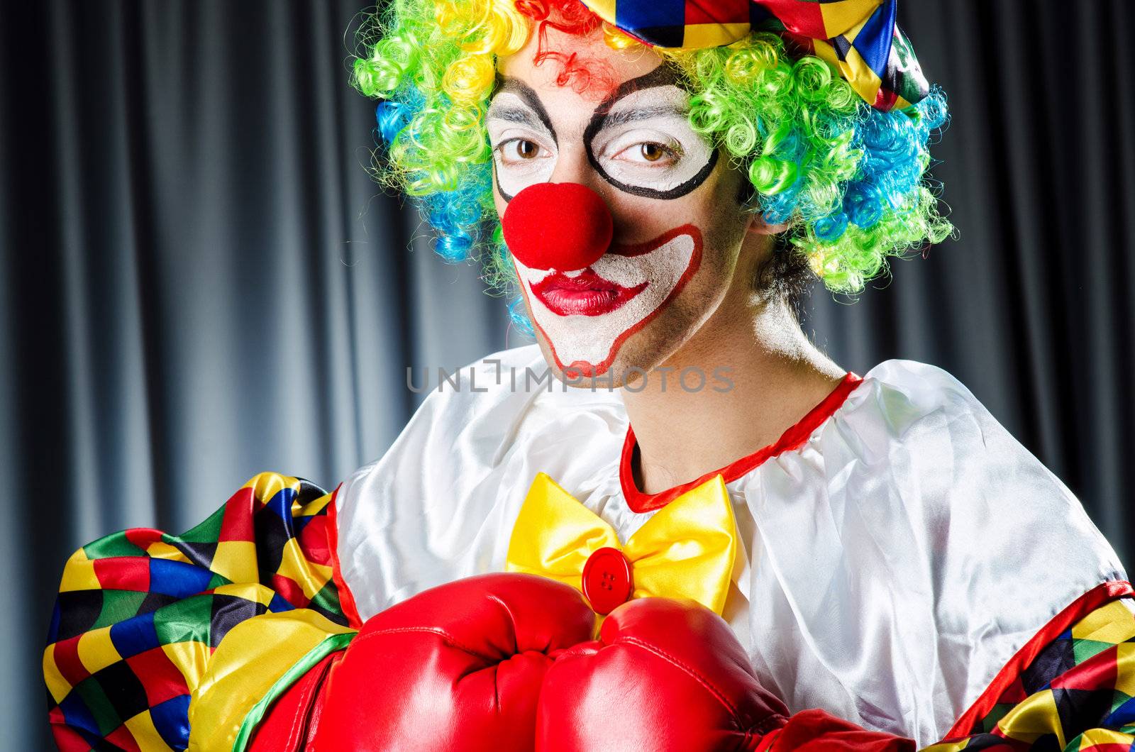 Funny clown in the studio shooting by Elnur