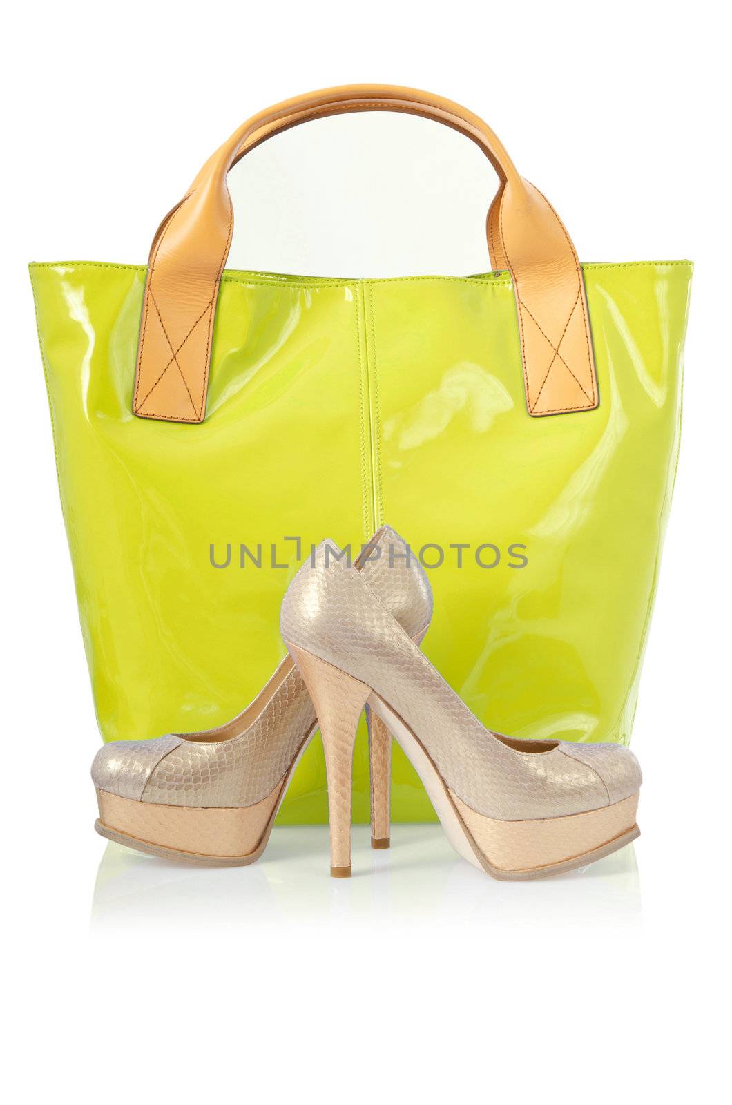 Elegant bag and shoes on white