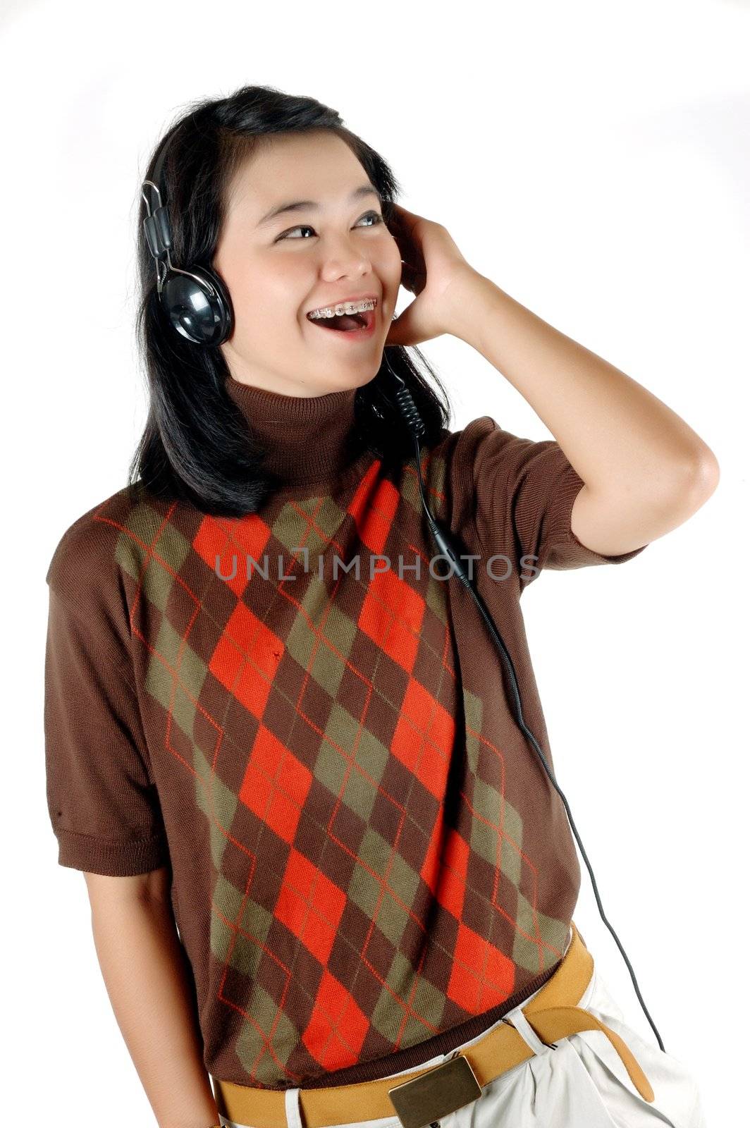 Young woman was listening music with headphone isolated on  white background
