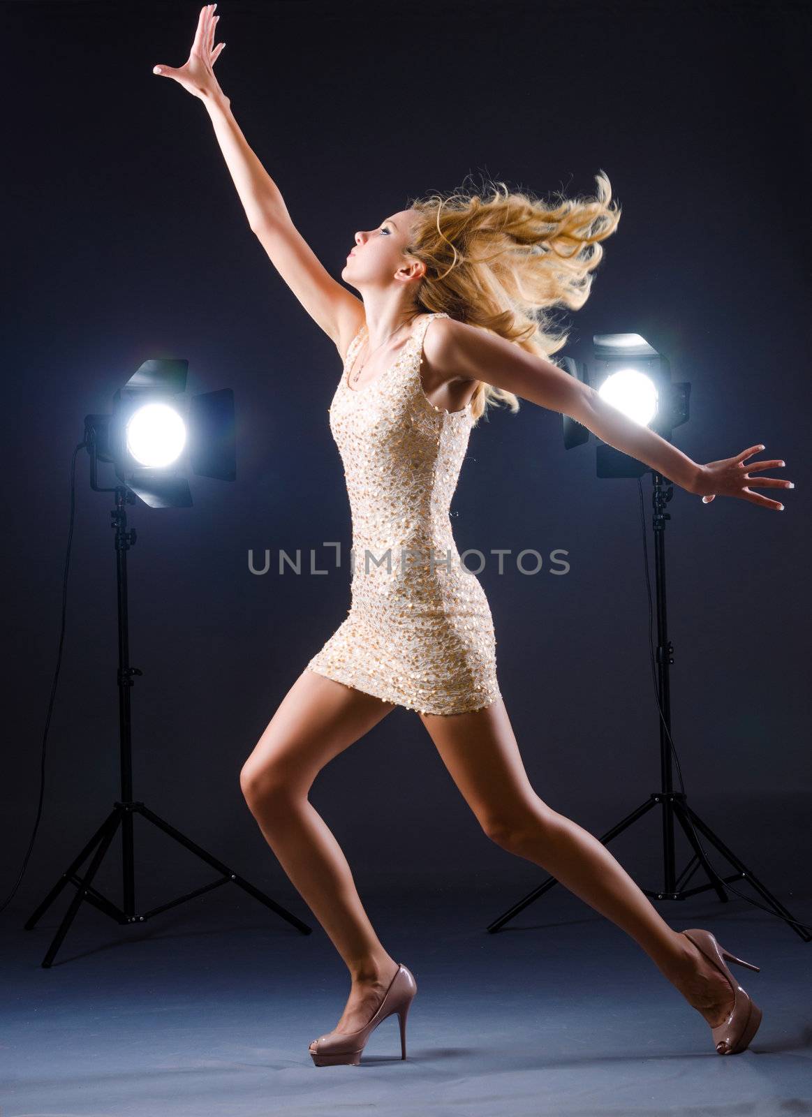 Young attractive woman in photo studio