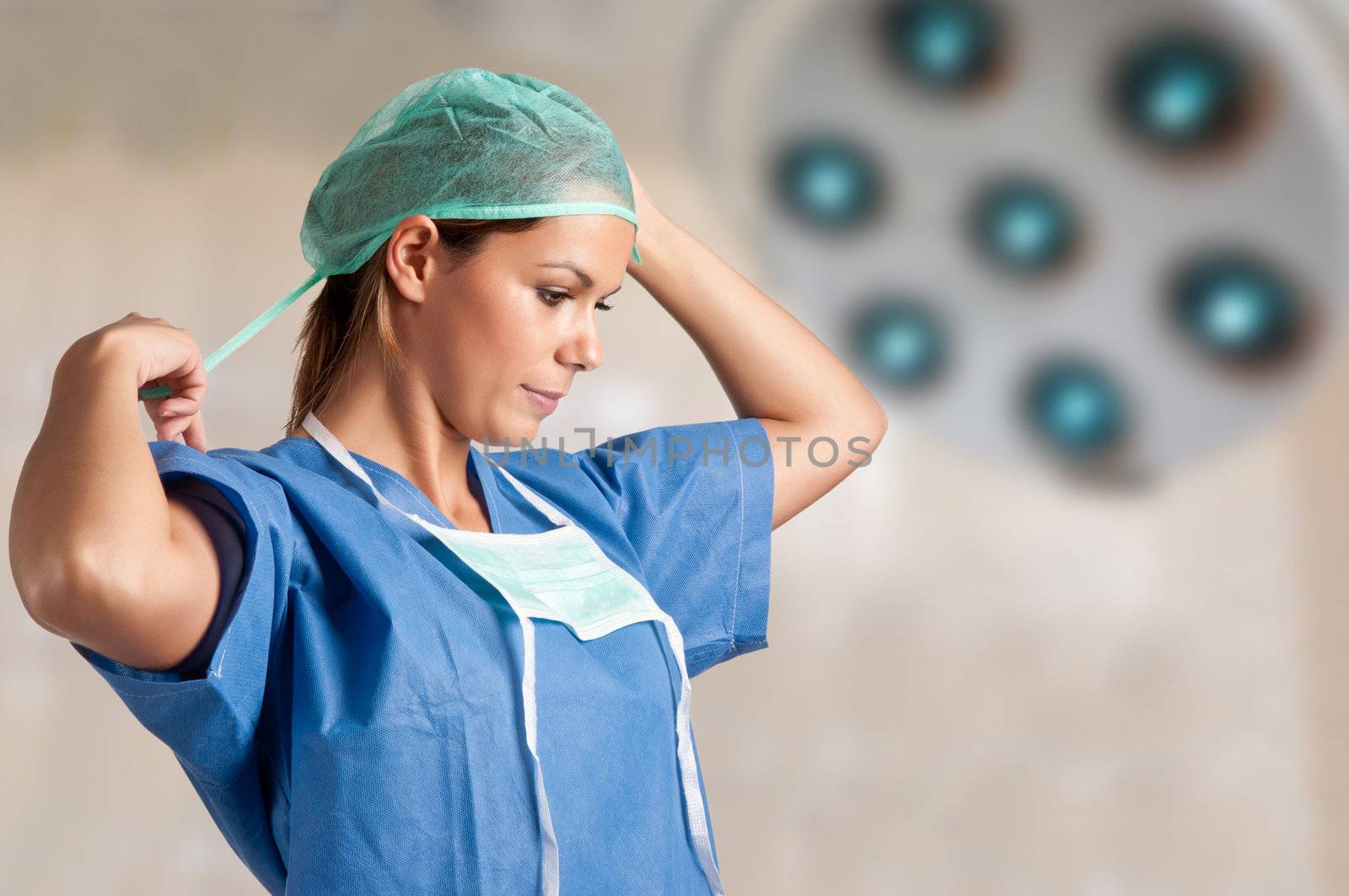 Young female surgeon getting ready for a surgery