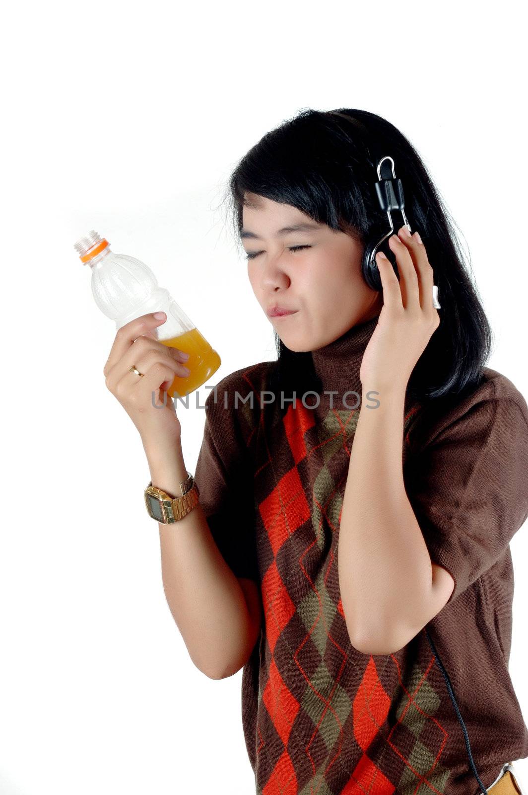 Young woman listening the music and enjoy with her soft drink isolated on white background
