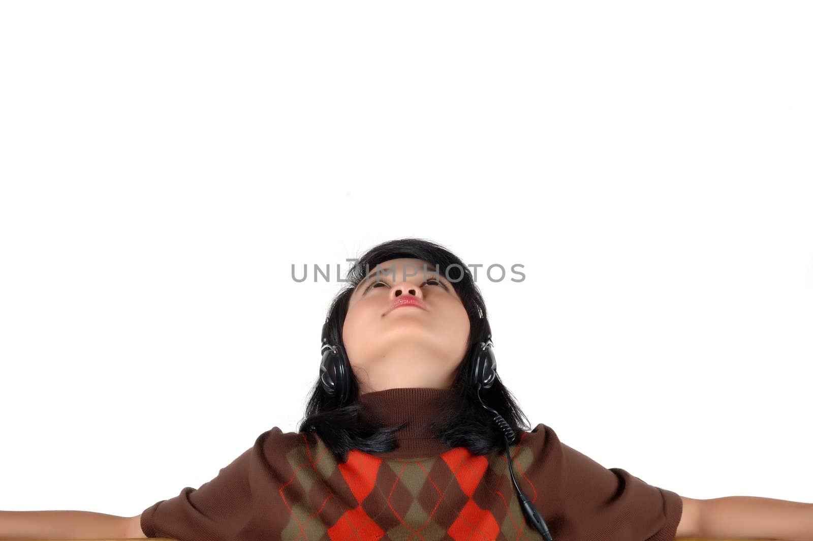 young  woman looked up to the top and enjoying the music isolated on white background