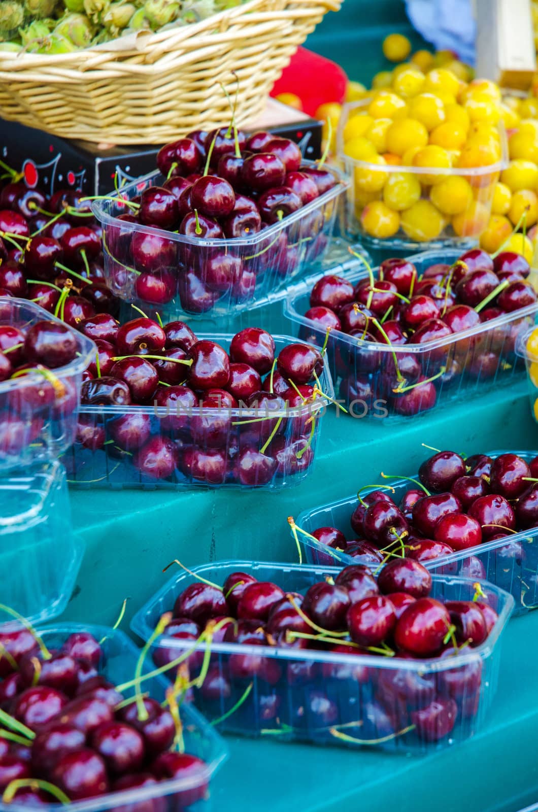 Fresh cherries on the marker