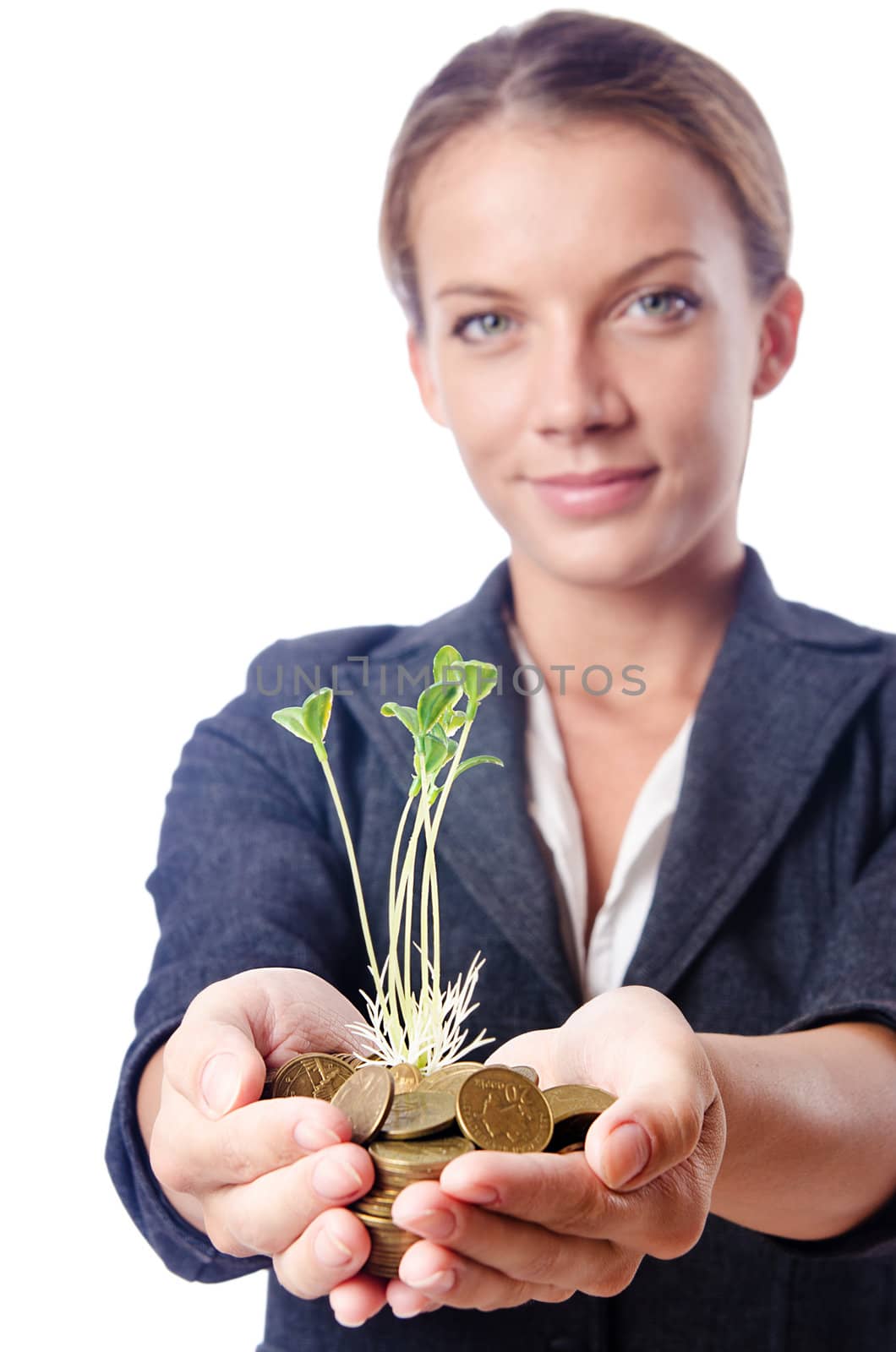 Businesswoman with seedlings and coins