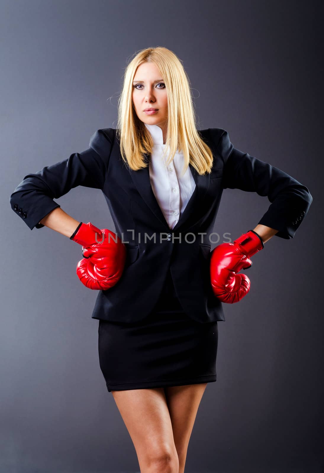 Woman boxer in dark room