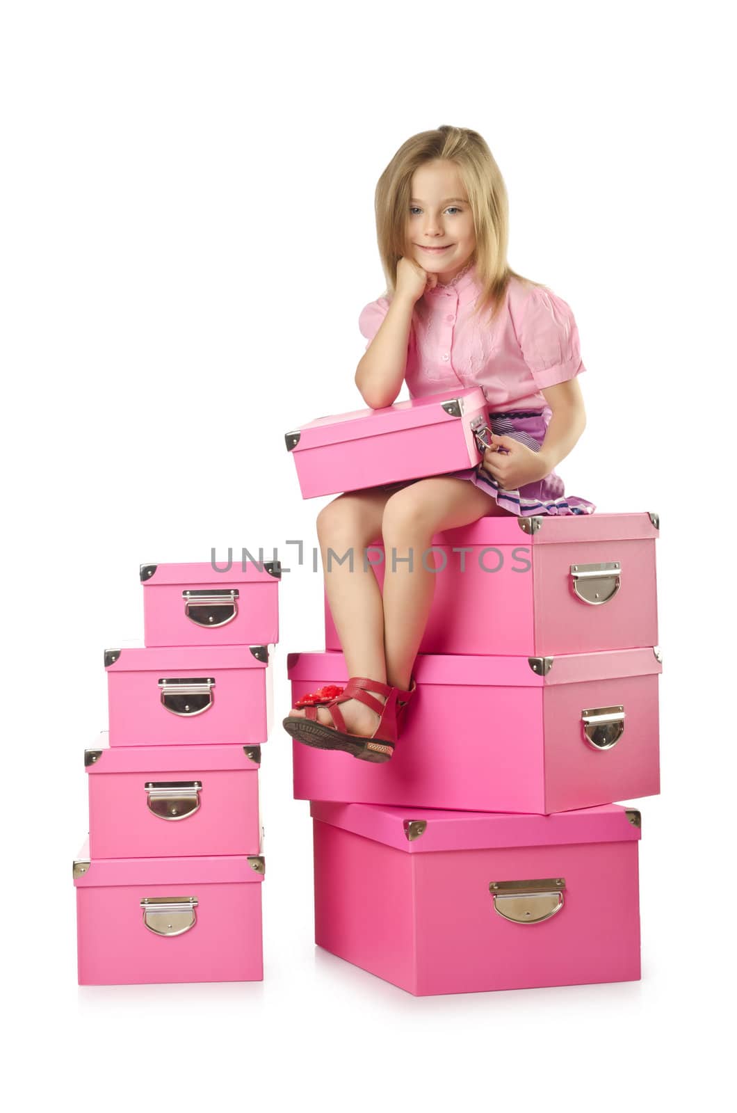 Little cute girl with lots of boxes