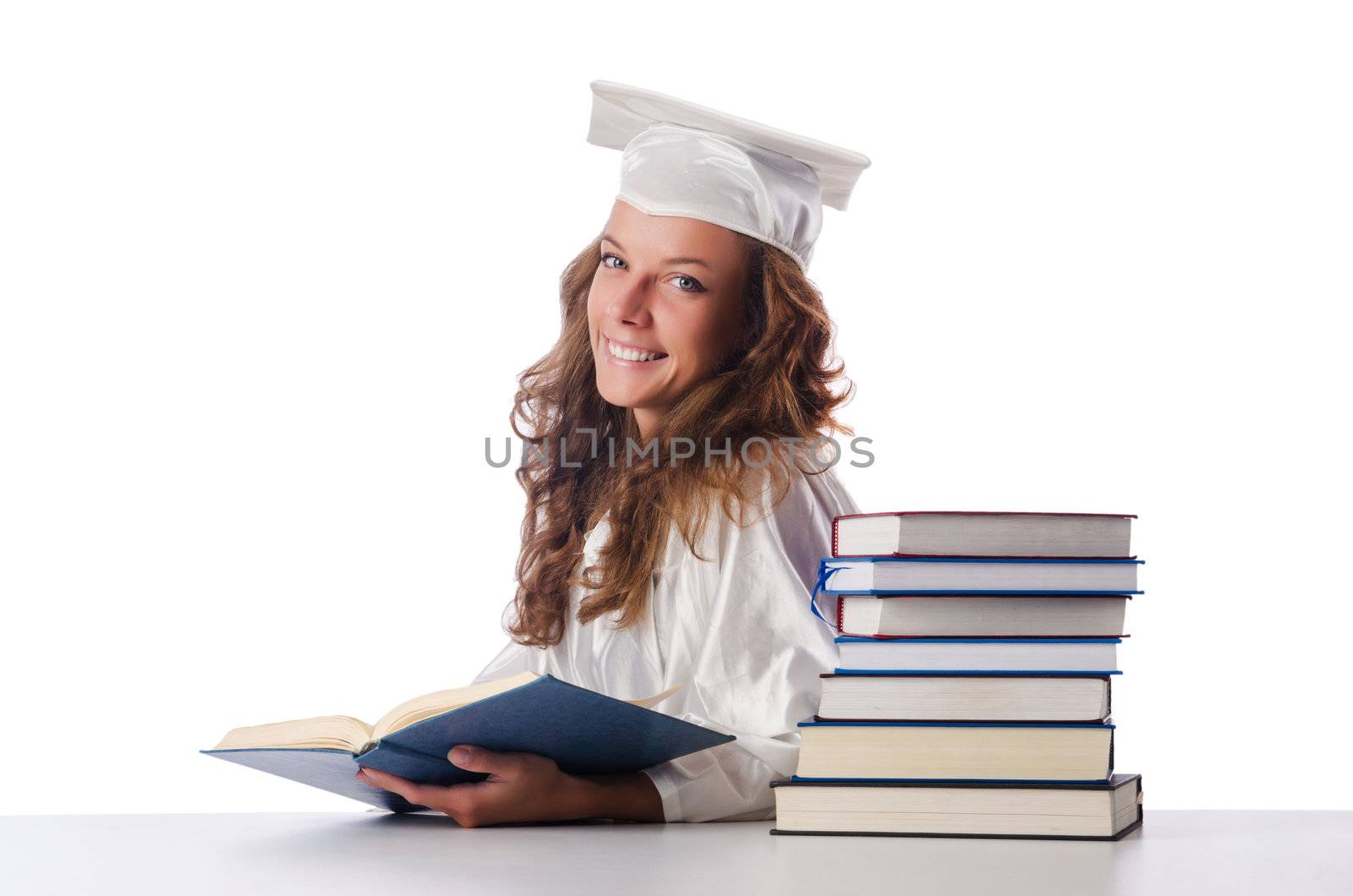 Happy graduate with lots of books on white