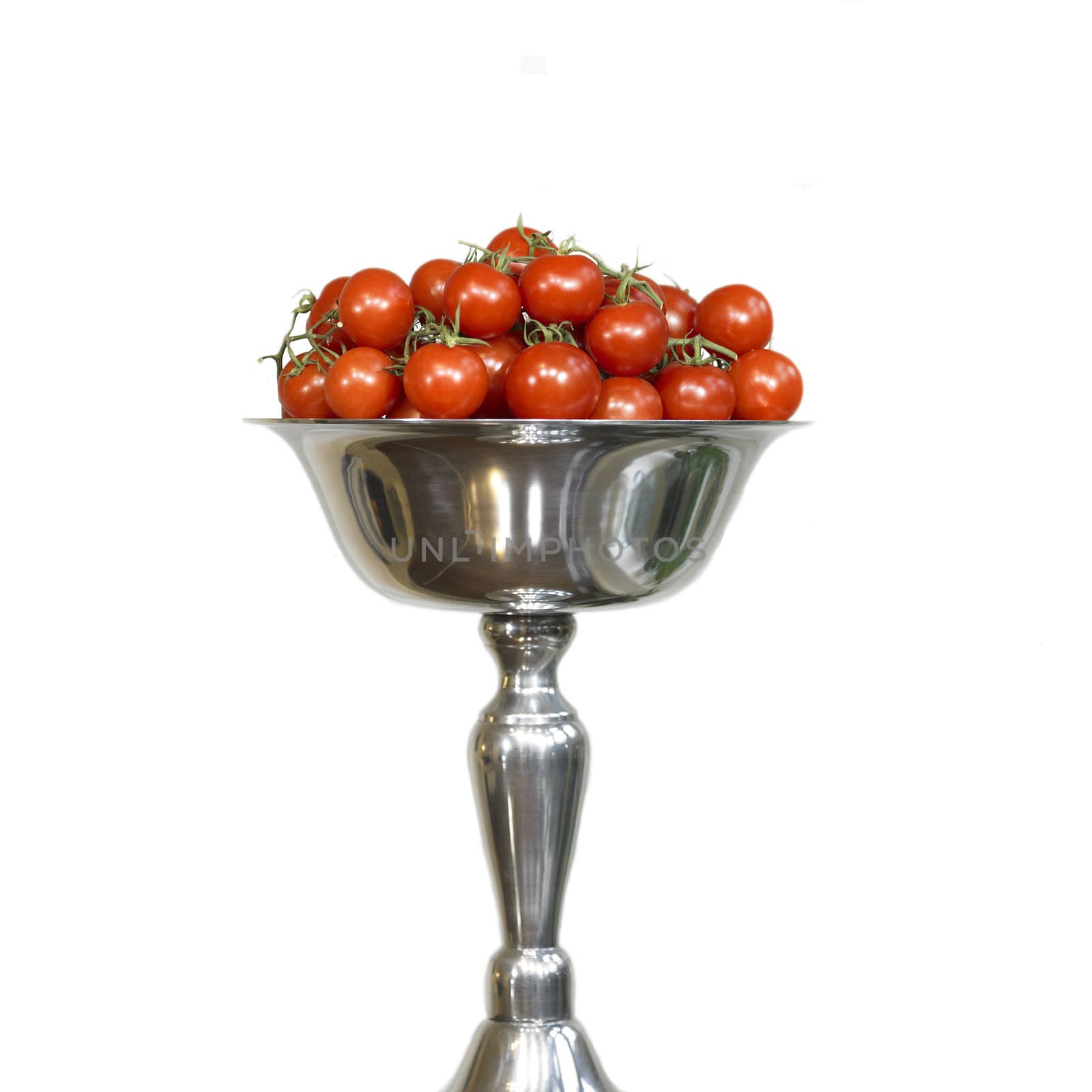 vine tomatoes in a silver pedestal bowl