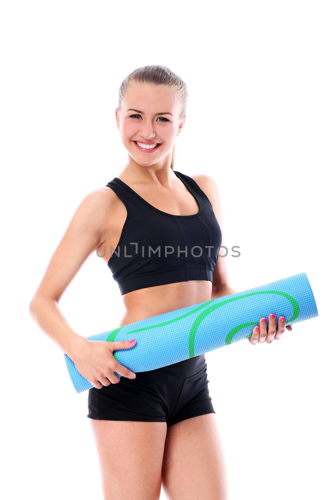 Young smiling woman holding mat for fitness