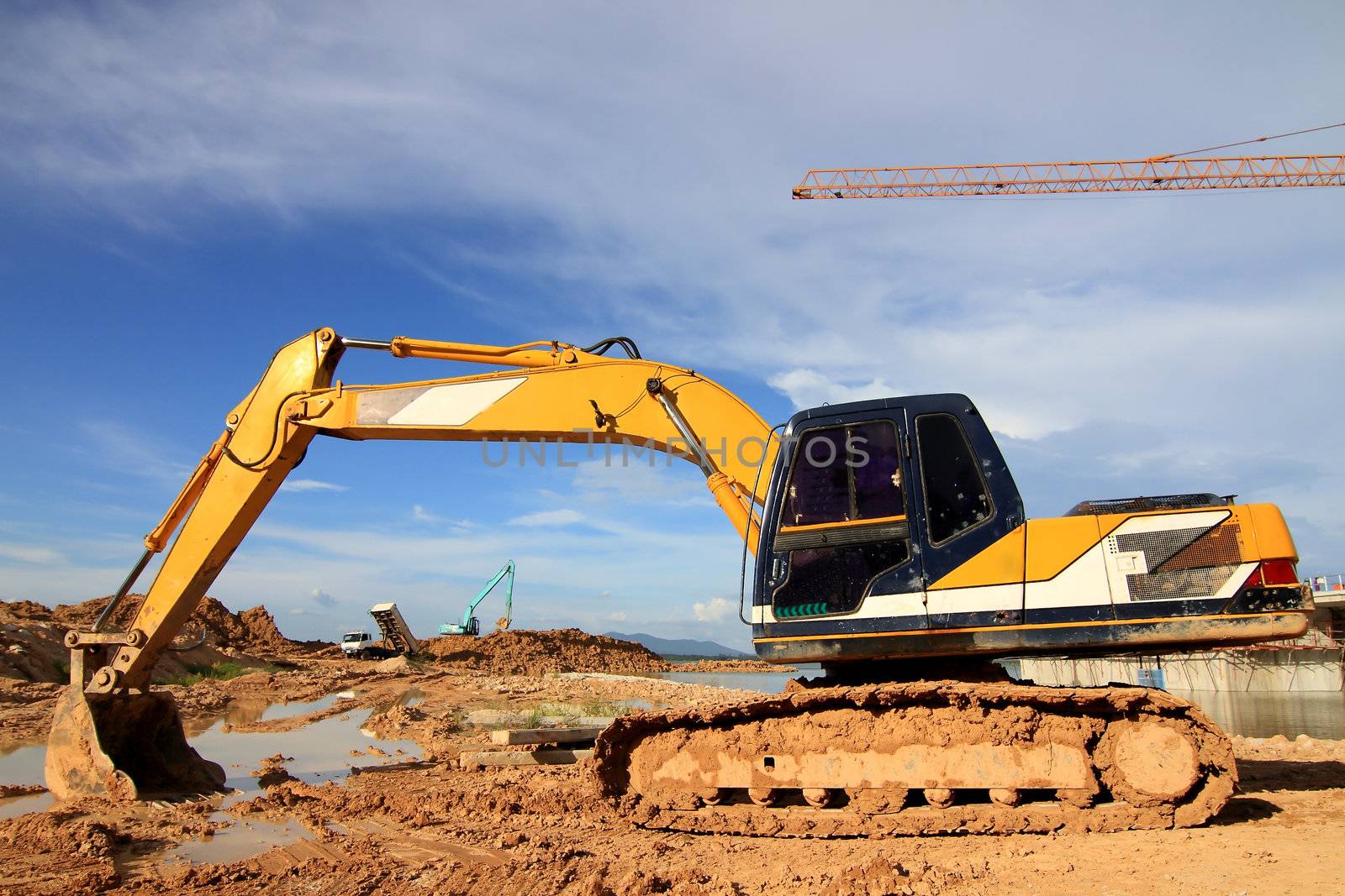 excavator loader machine during earthmoving works outdoors at co
