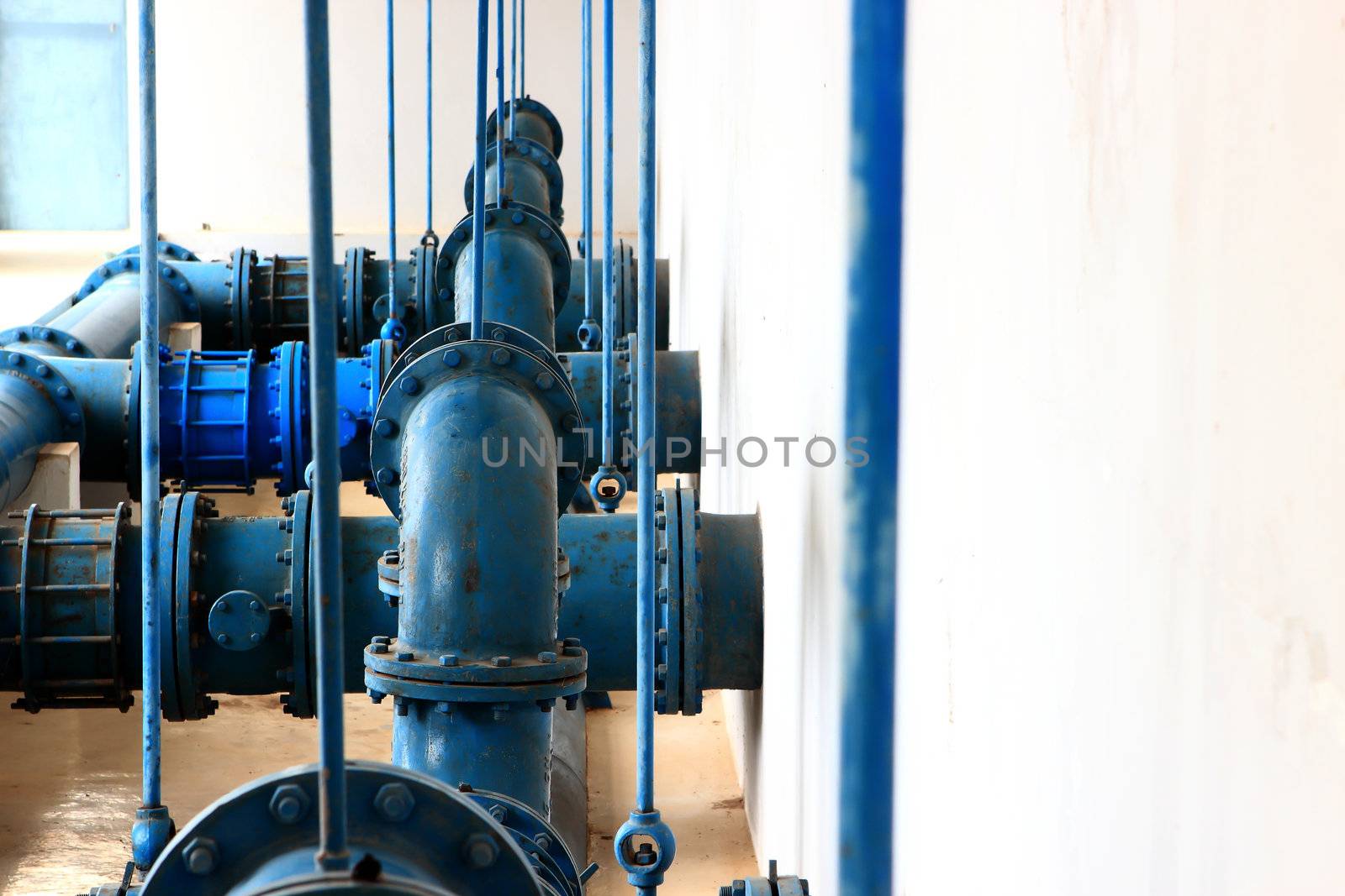 Water pumping station, industrial interior and pipes