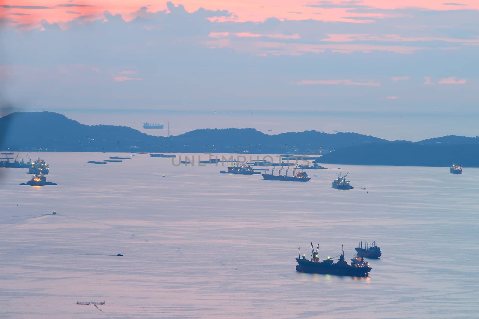 image of Cargo ship at twilight time.