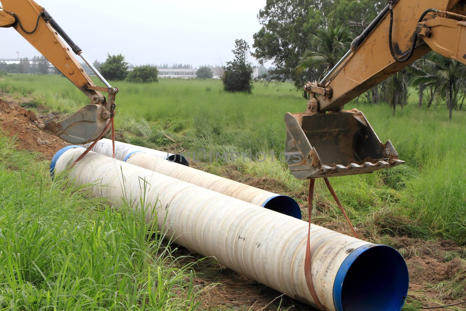 Specialized equipment for placing large diameter pipe in a trench