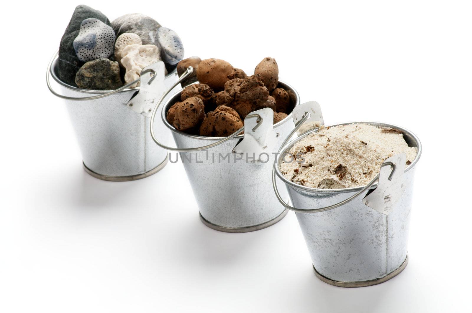 Tin Buckets with Sand, Gravel and Stones in a Row isolated on white background