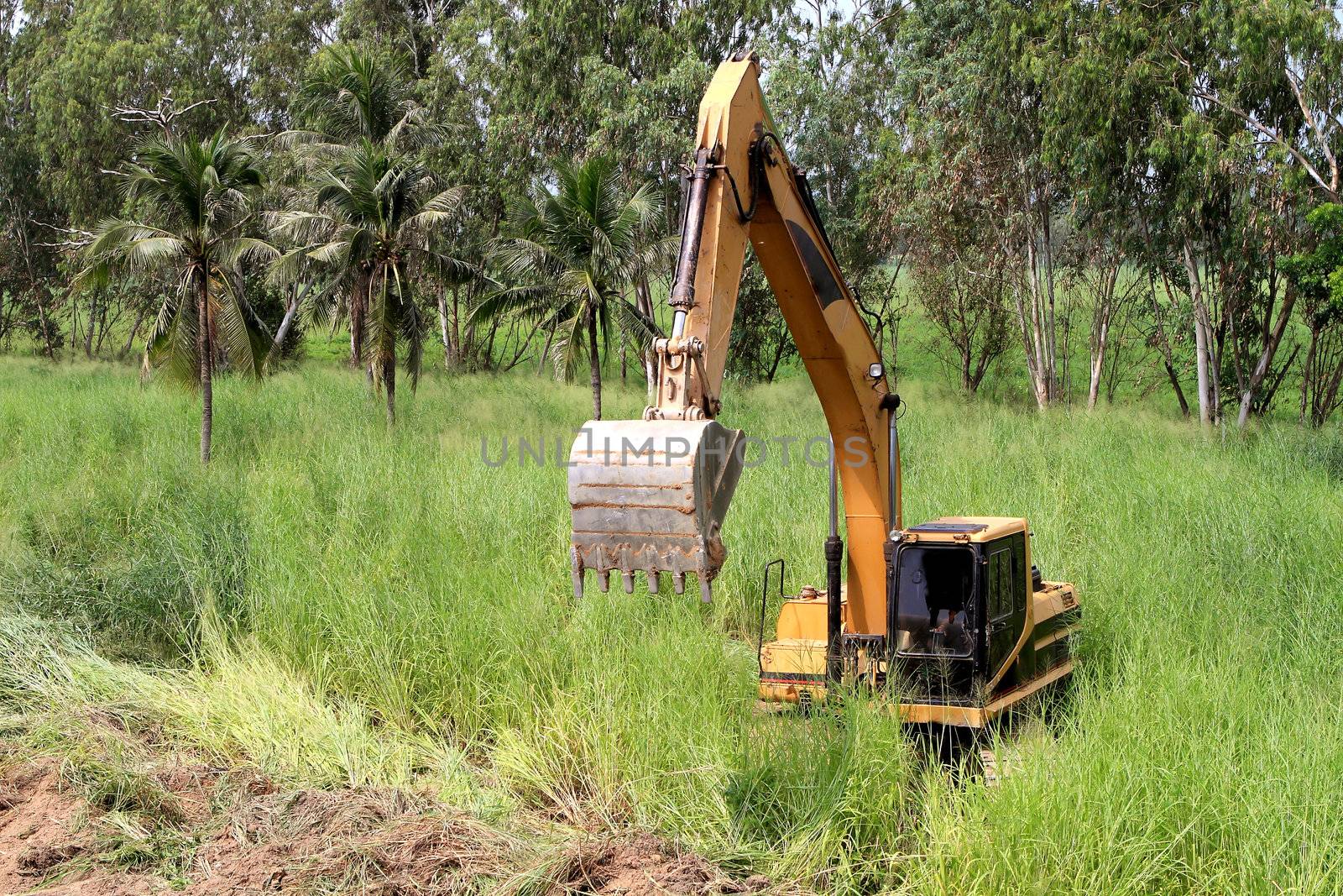 excavator loader machine during earthmoving works outdoors at construction site