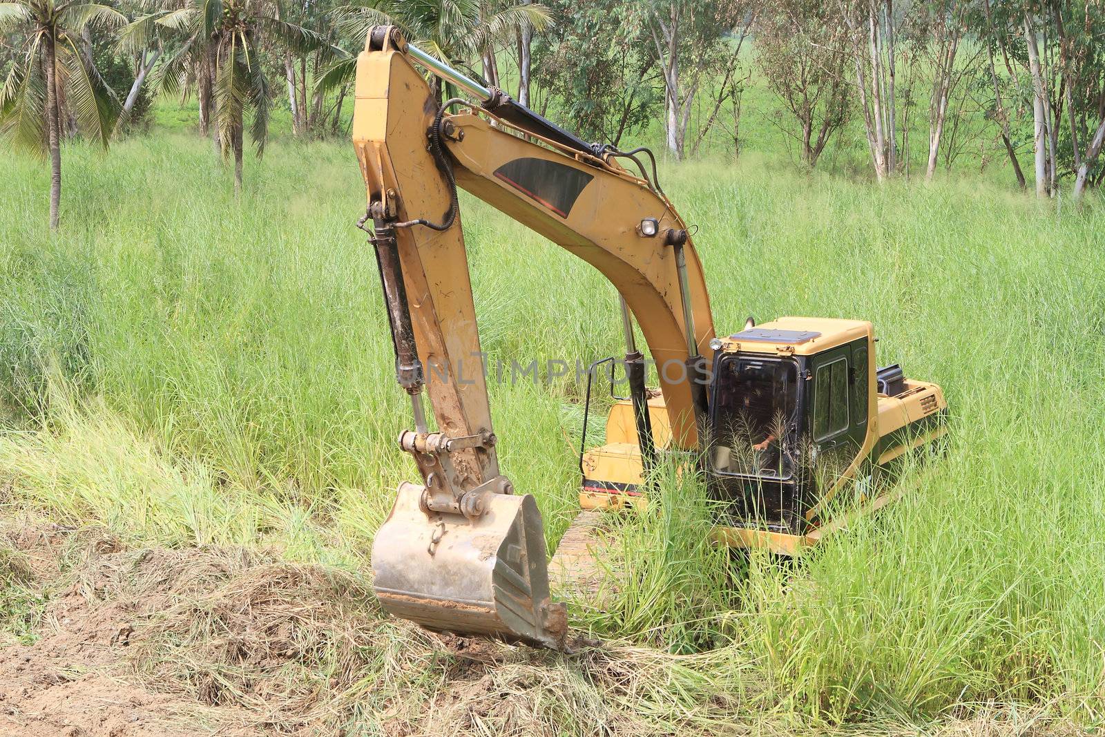 excavator loader machine during earthmoving works outdoors at construction site