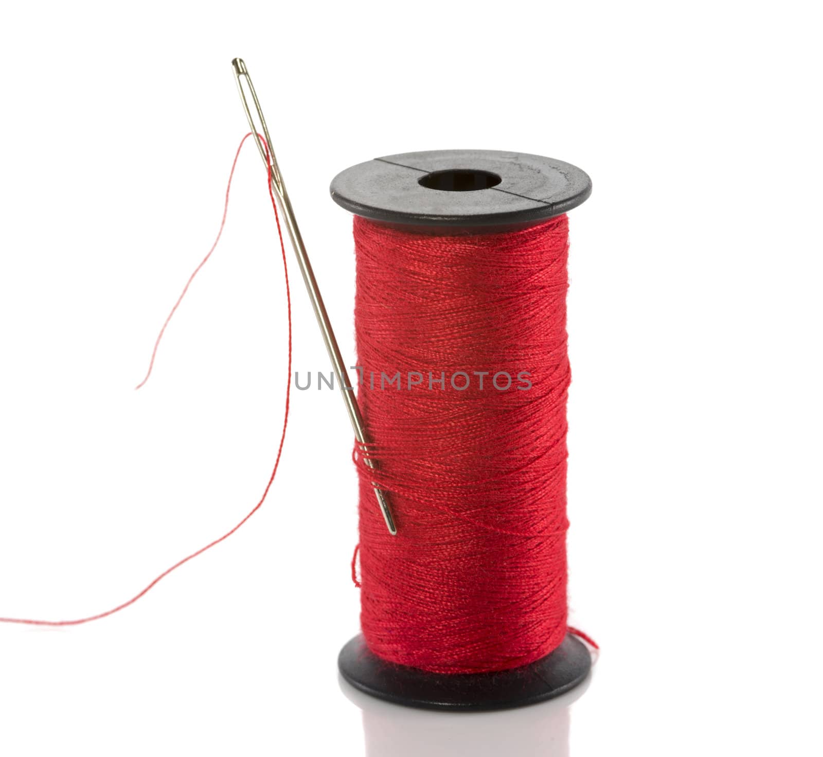 red thread cotton isolated on white