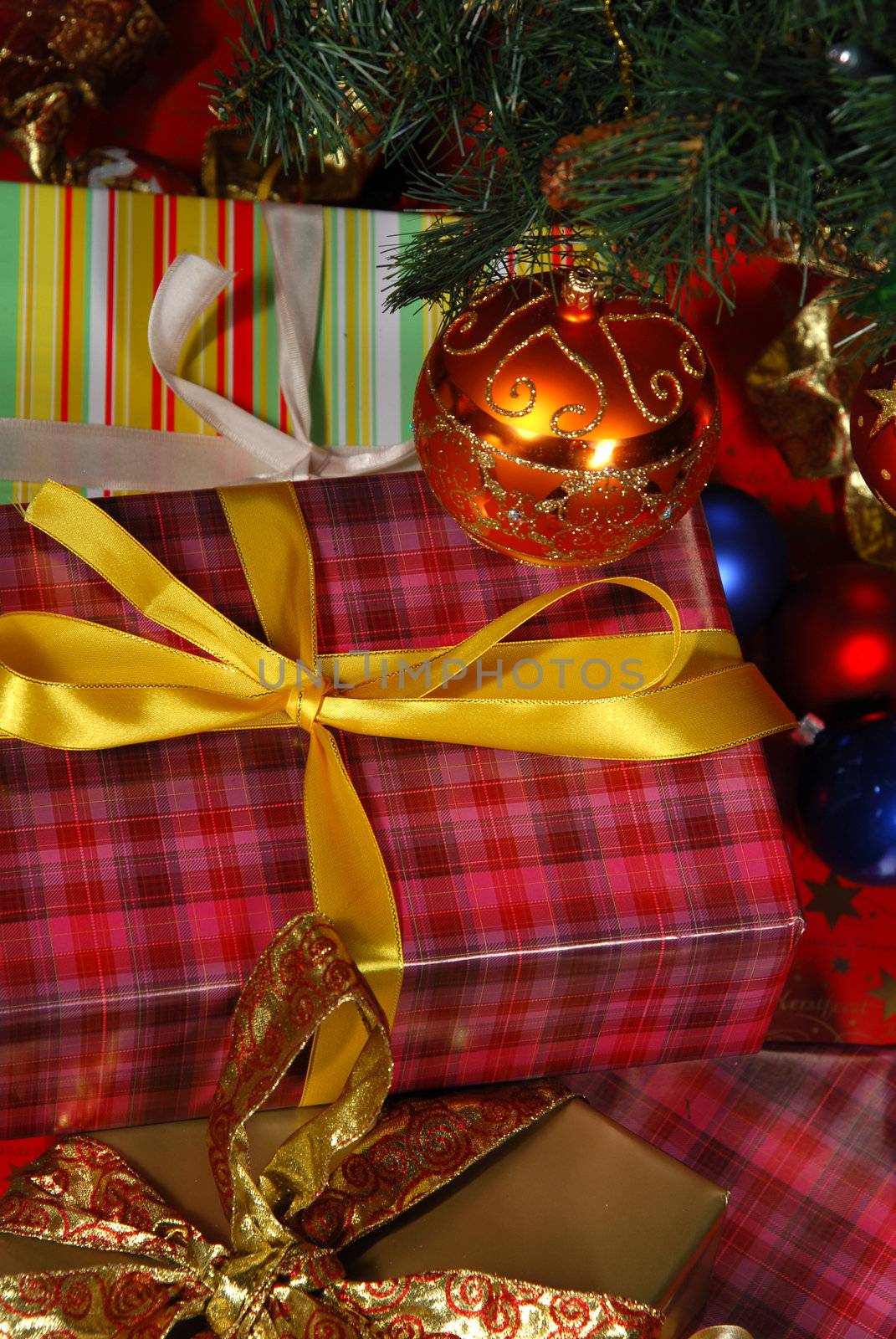 Gifts under the Christmas tree lights background