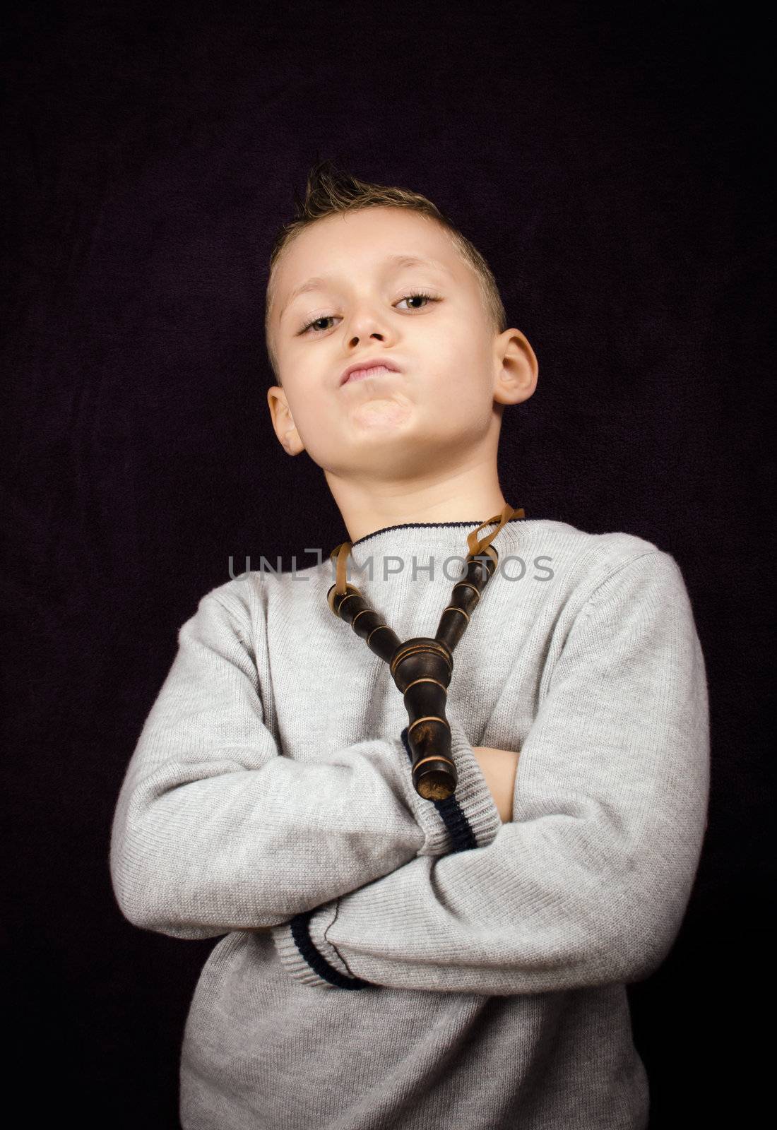 Studio shoot of a little boy with a bad attitude