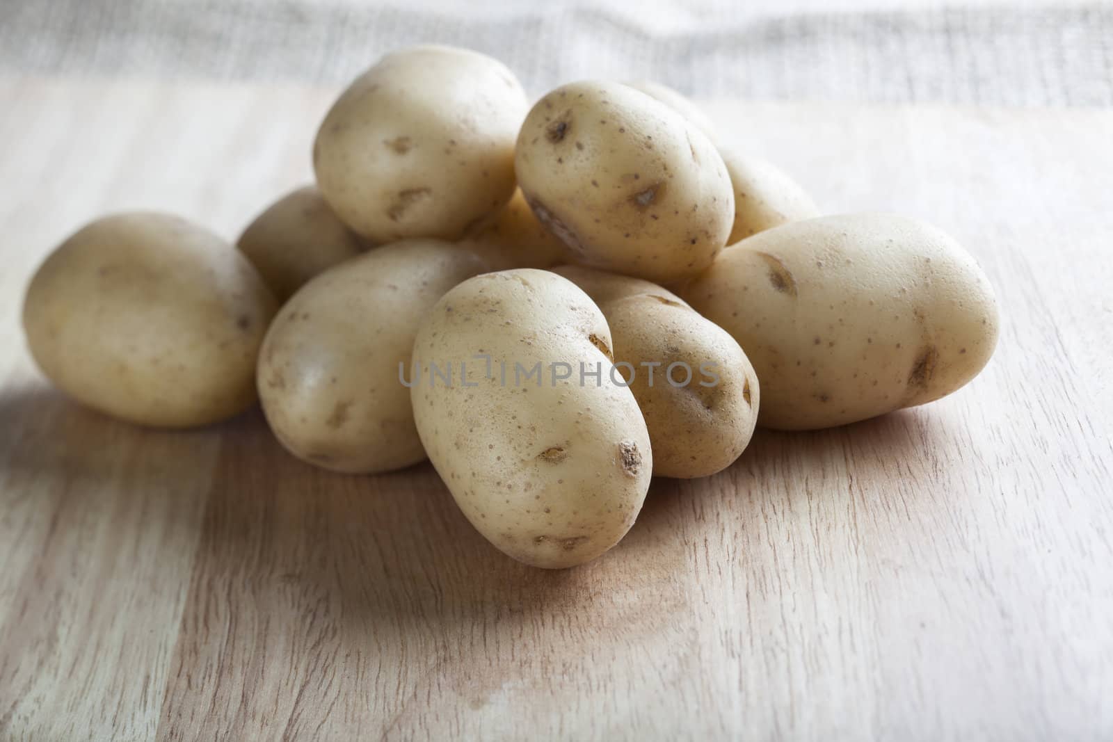 Raw new potatoes on a cutting board