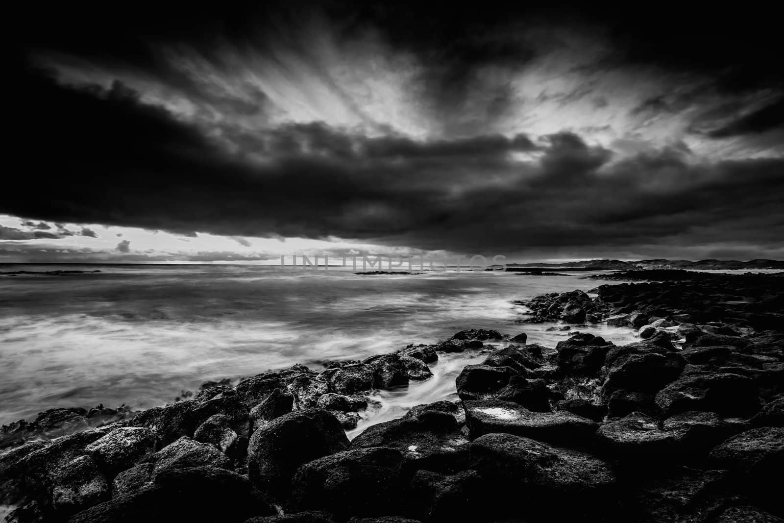 Another shot from a cold sunset shoot. Extra long exposure was used to capture the cross flowing cloud and flat sea.