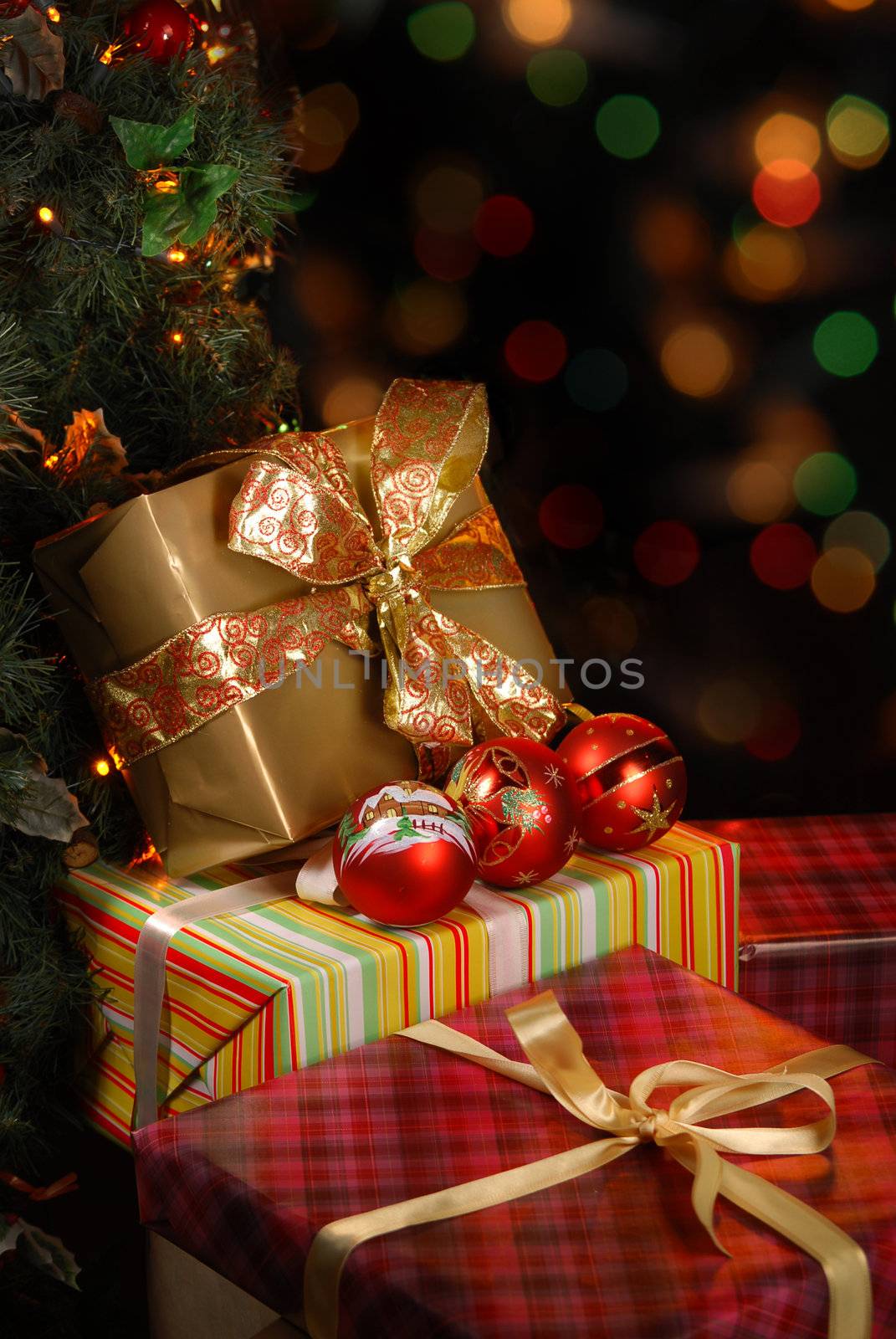 Gifts under the Christmas tree lights background
