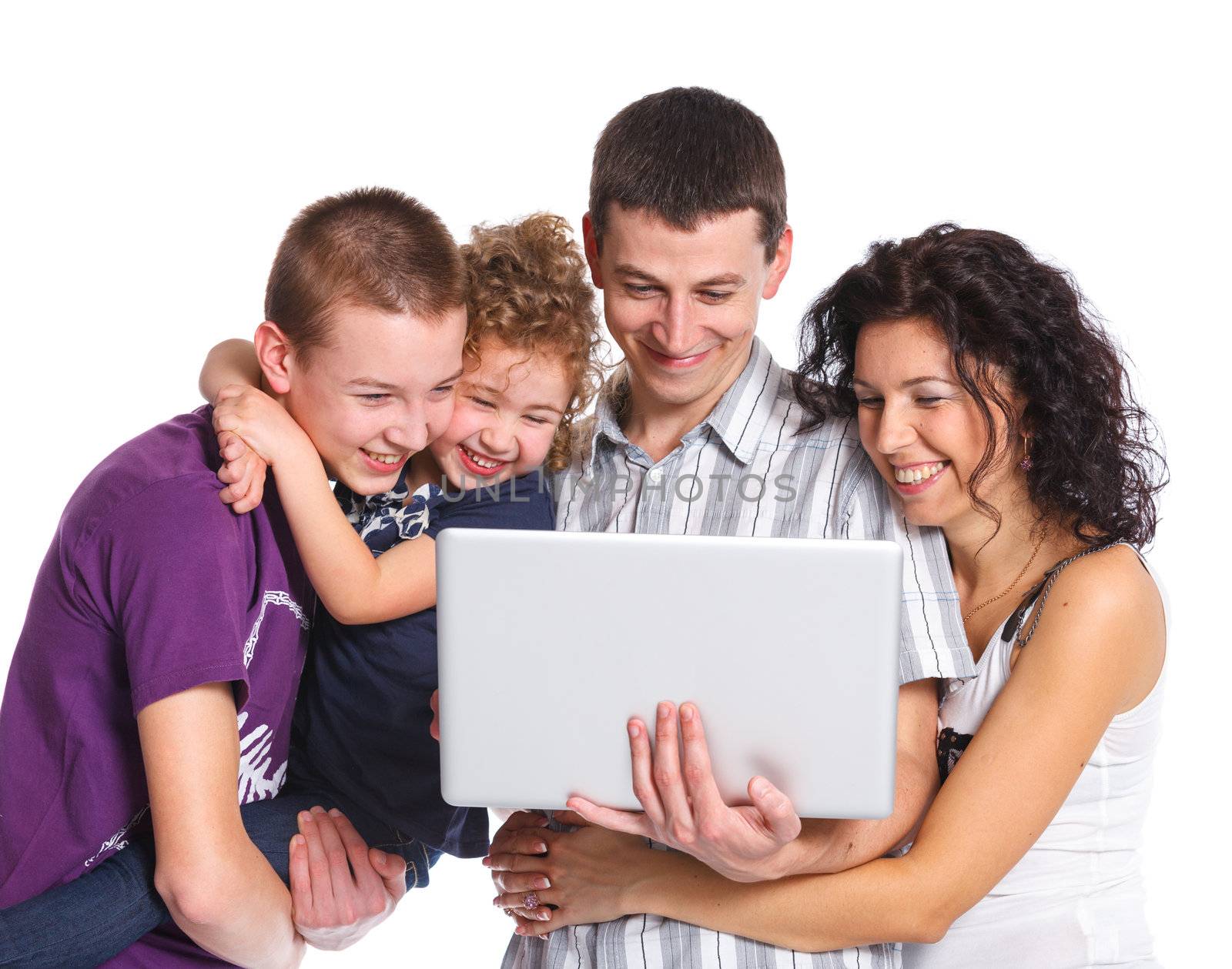 Happy family with children using on laptop computer