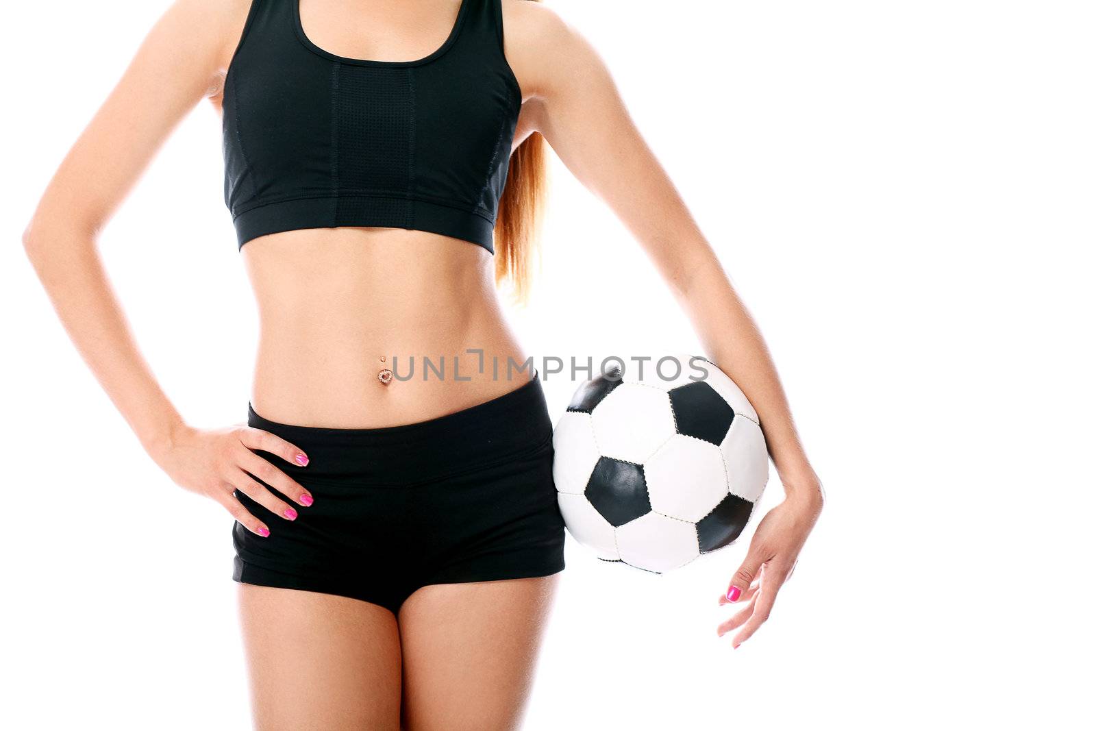 Young and sexy girl`s body with soccer ball over white background