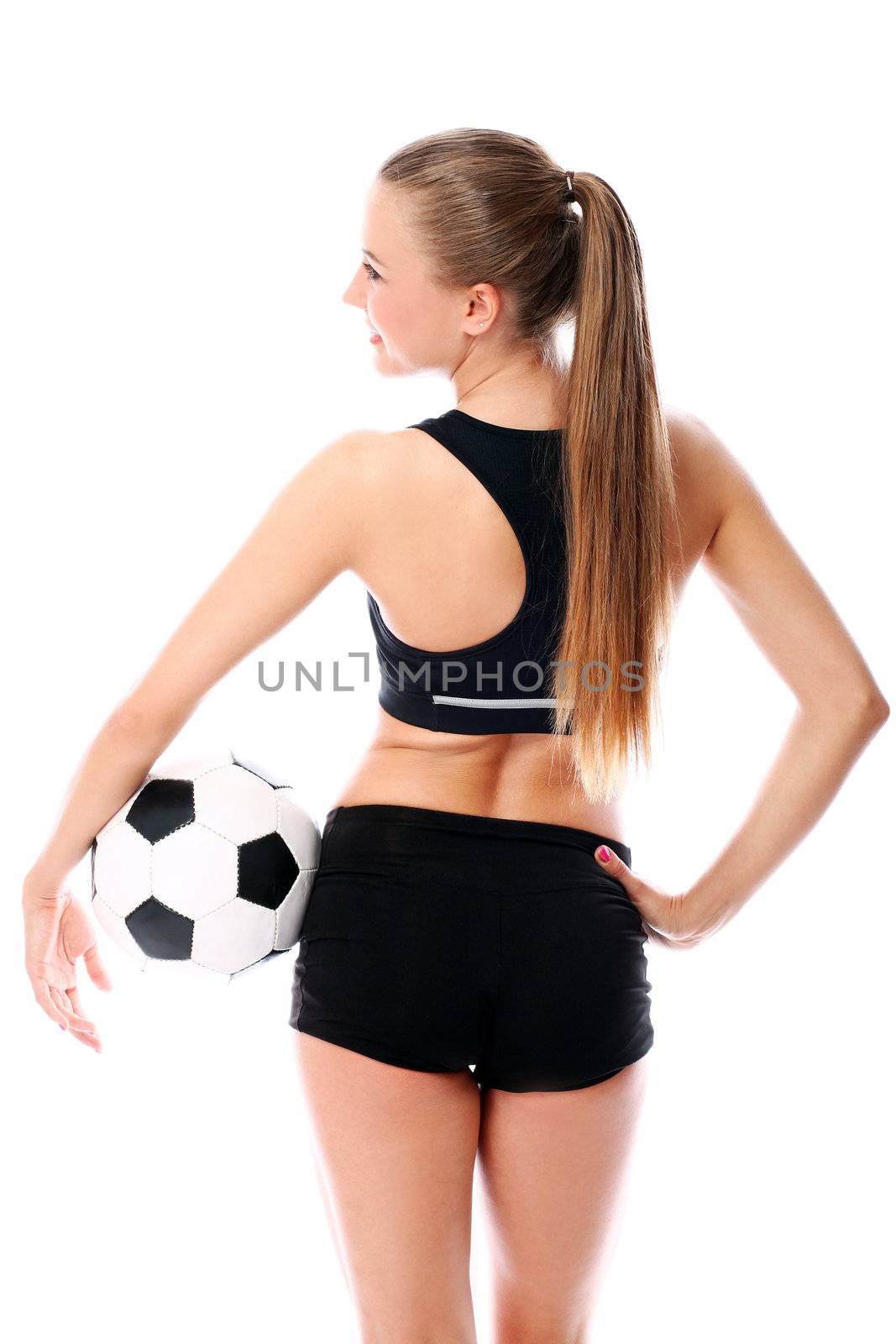 Young and sexy girl with soccer ball over white background