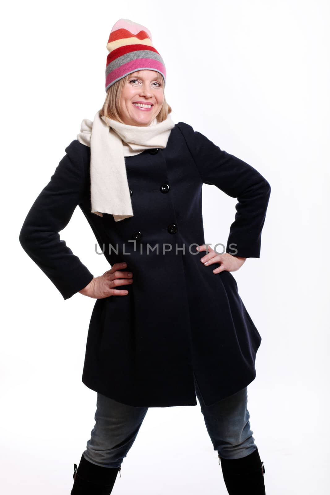 Warm dressed mid age woman over a white background