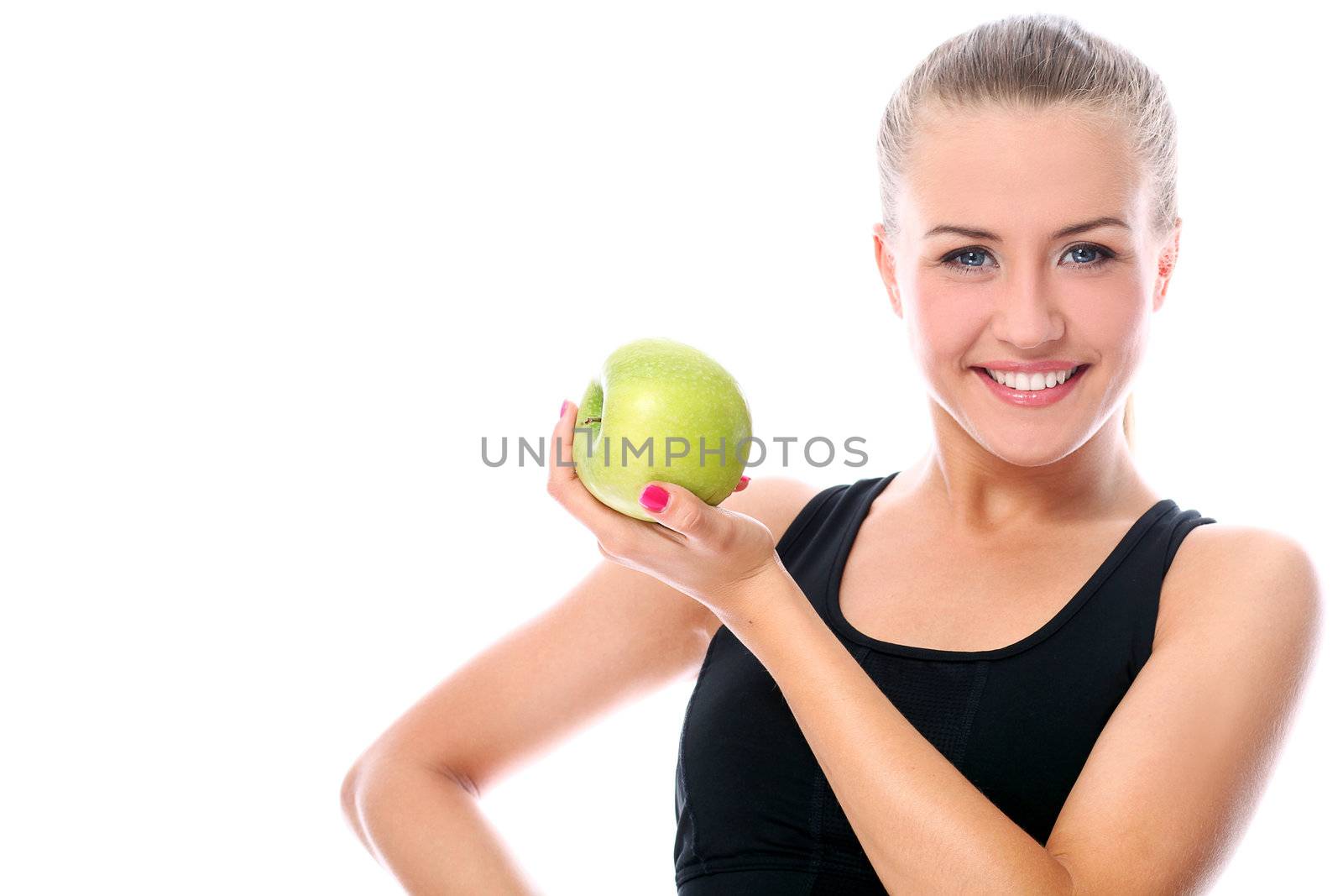 Beautiful fitness girl with green apple in hand over white background