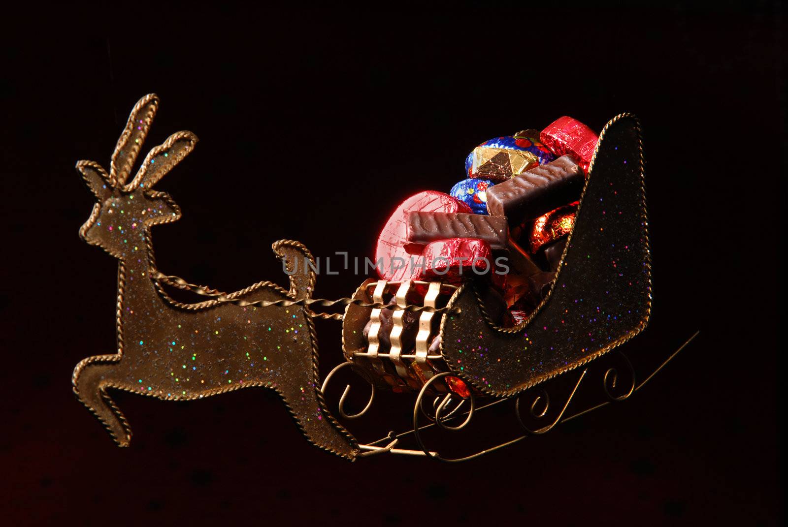 sweets on golden sleigh of Santa Claus