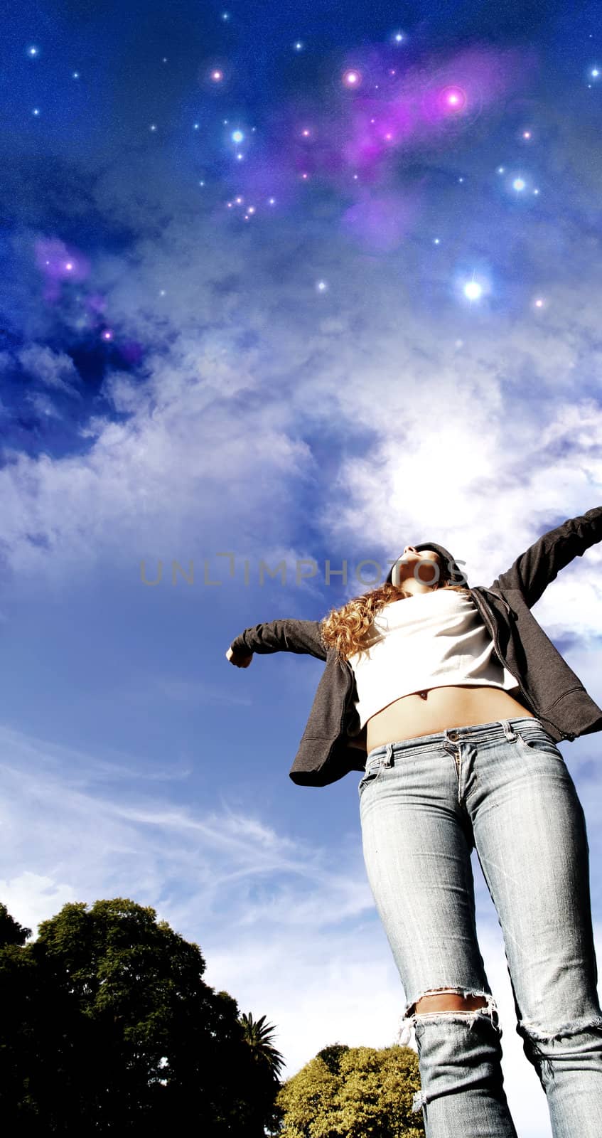 A young woman jumping to the night sky.