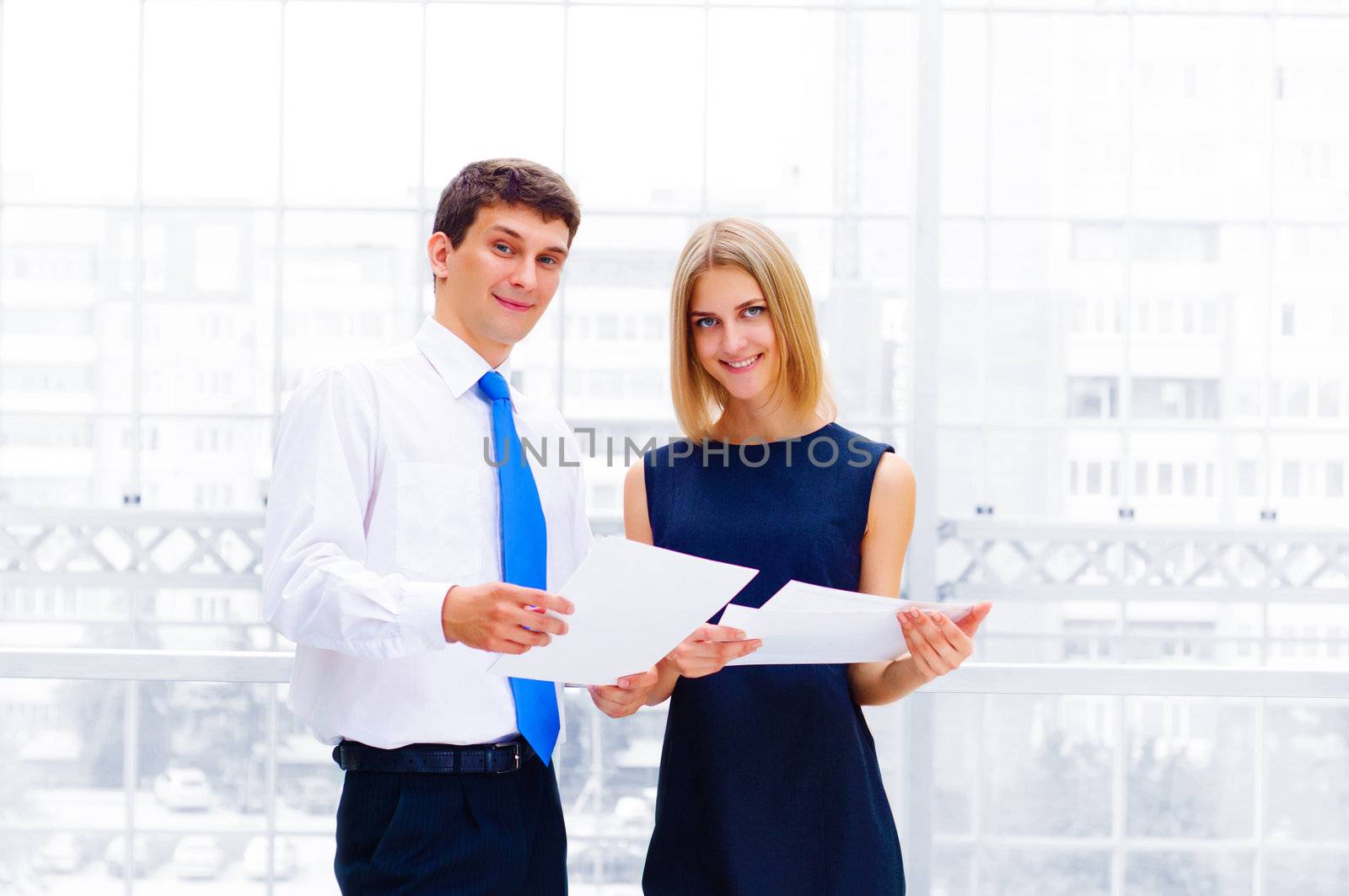 Portrait of young male and female entrepreneurs working together