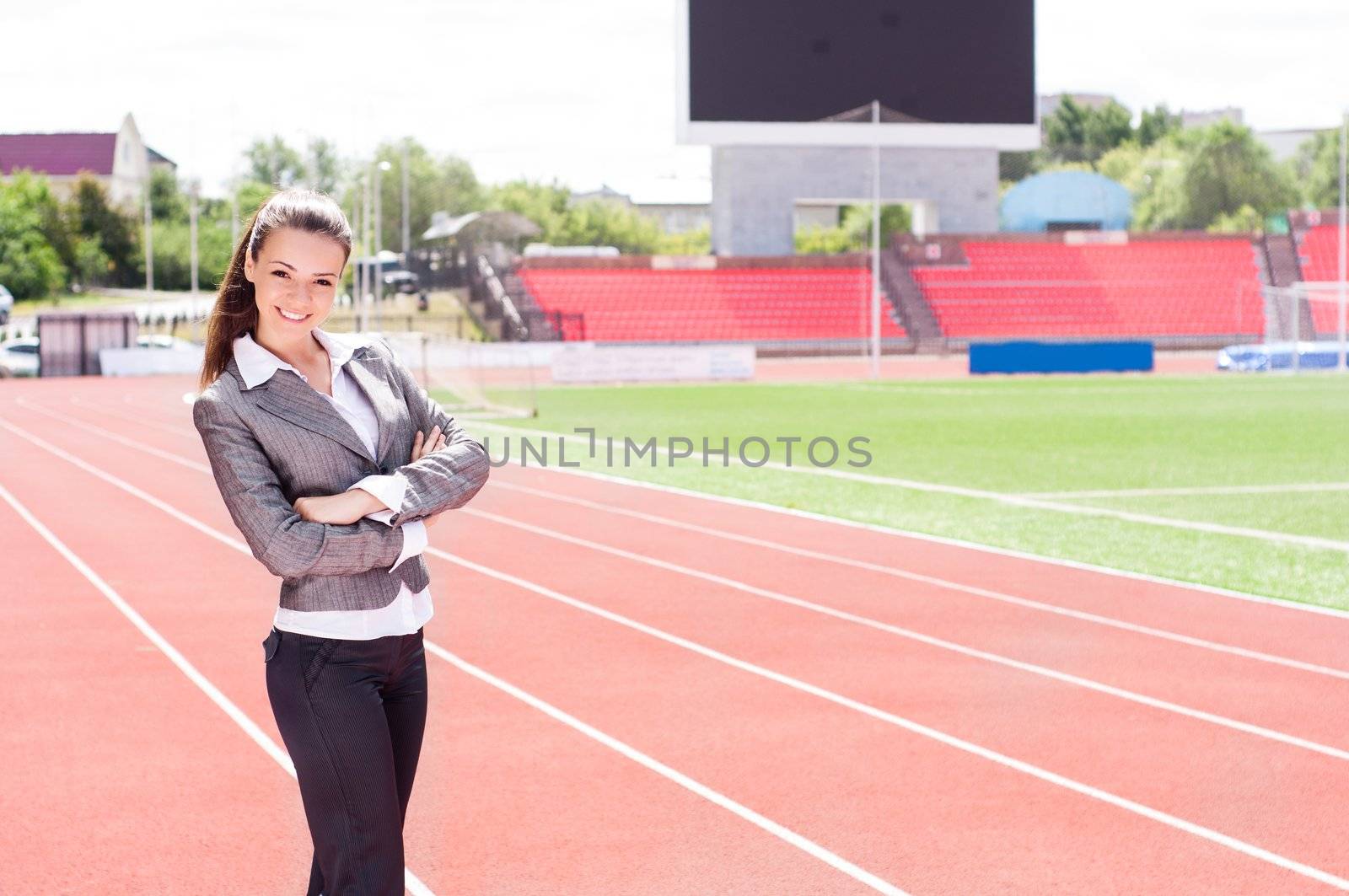 portrait of a beautiful business woman at a sports stadium, the competition in the business