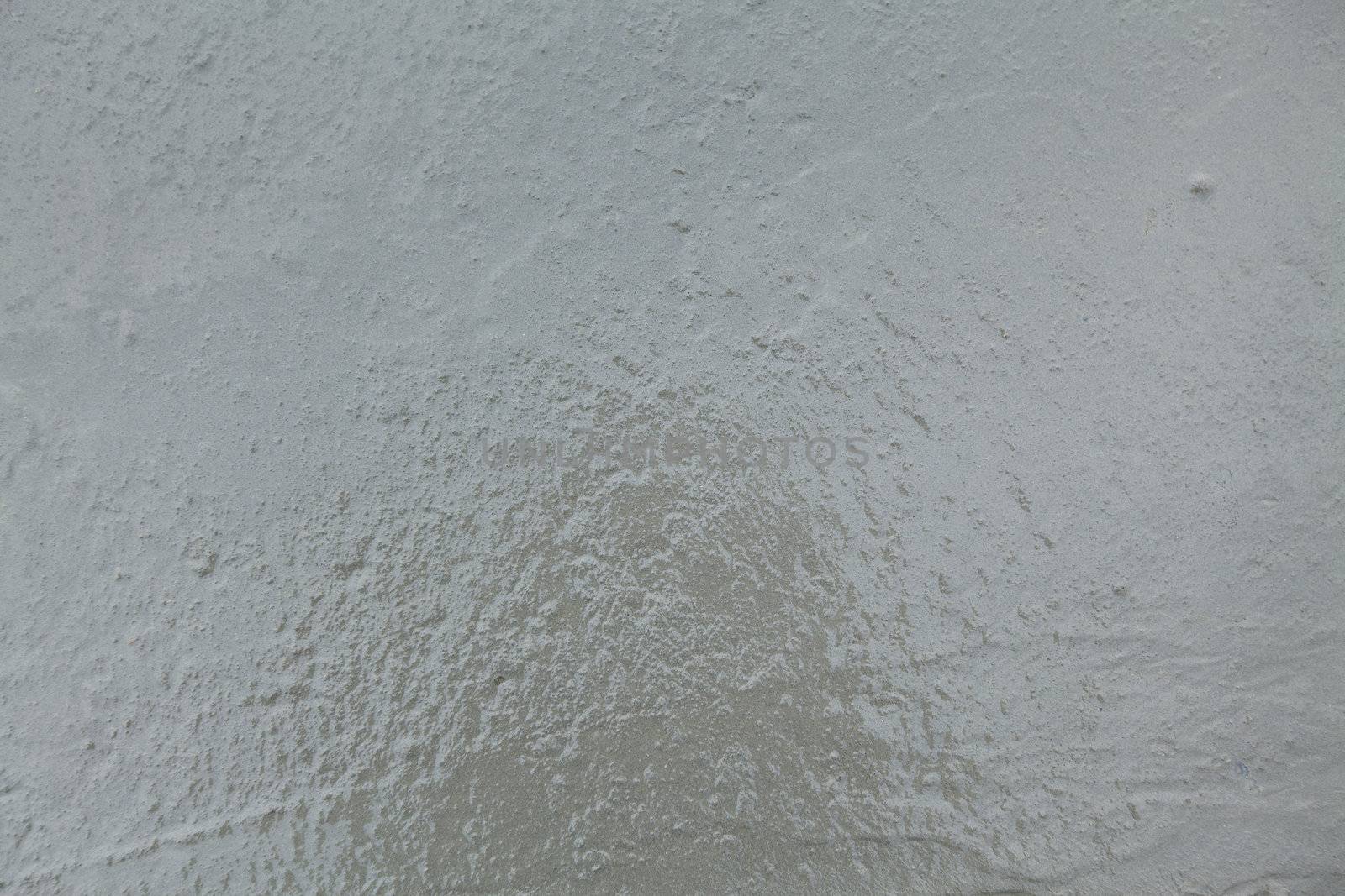 Closeup of a wet concrete. Textured surface