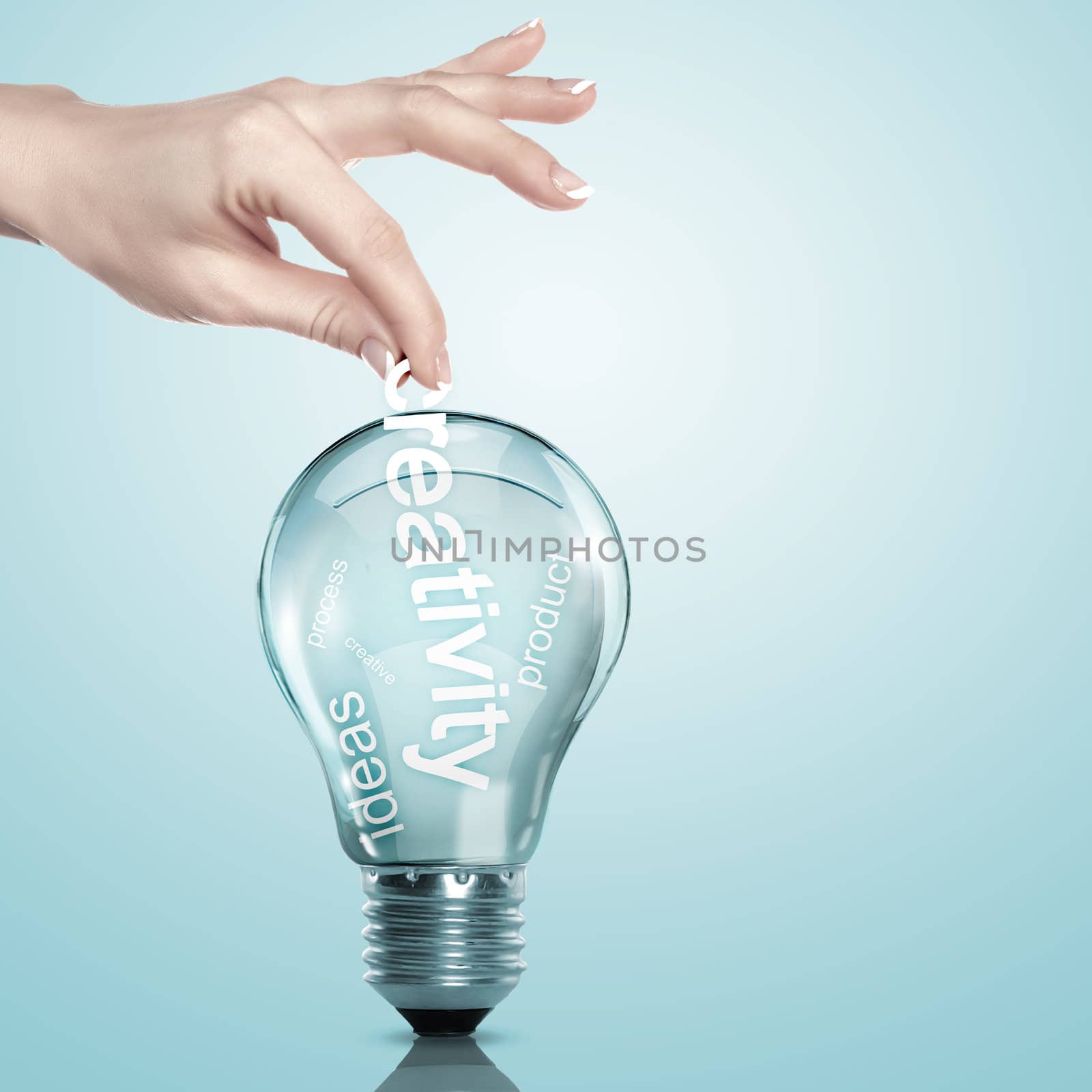 Human hand putting word Information inside a light bulb