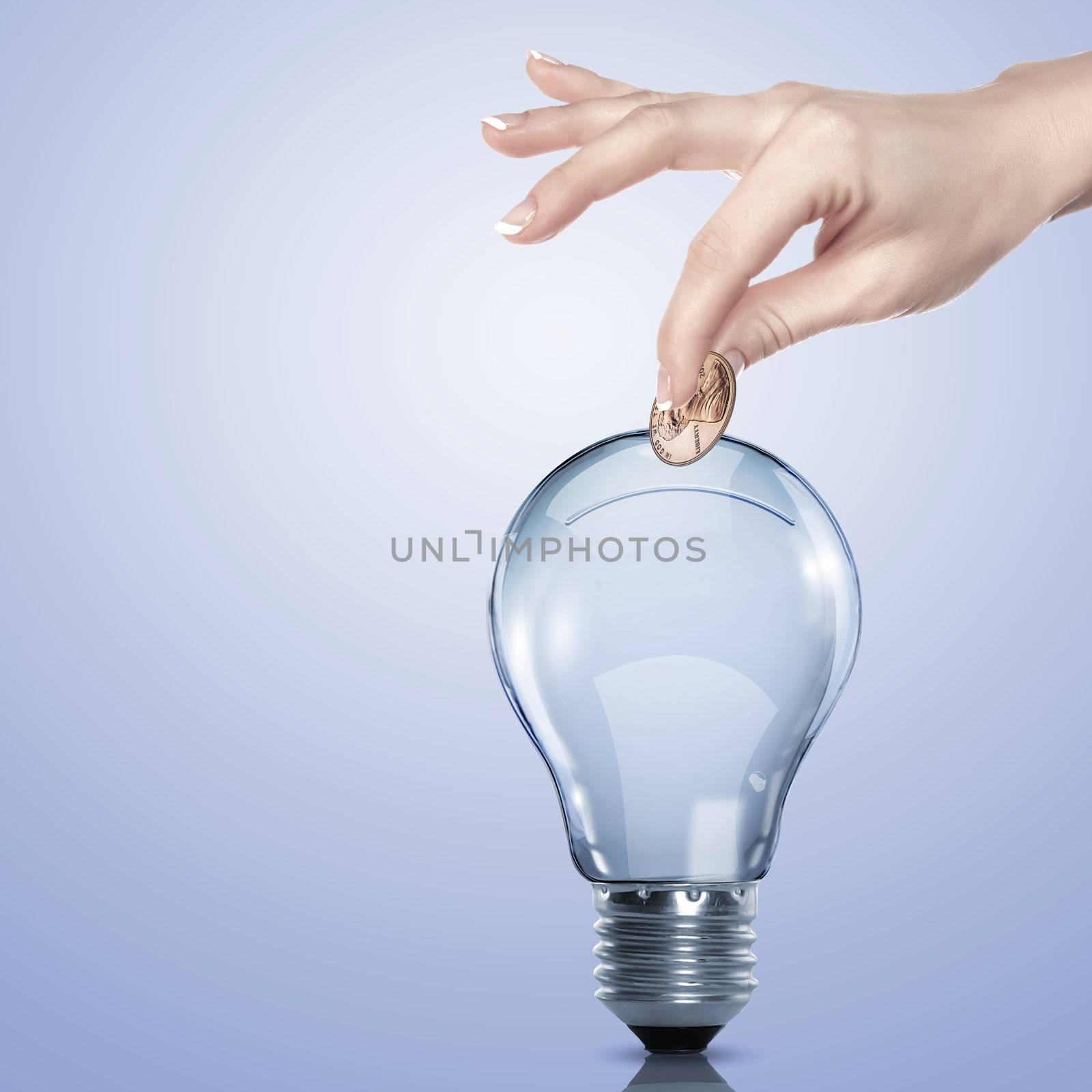 Hand and money inside an electric light bulb