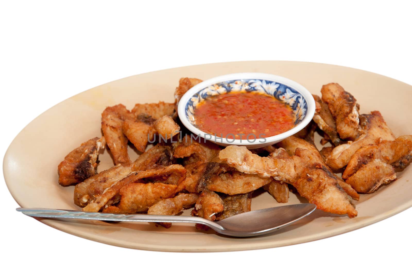 fried fish on dish isolated on white background