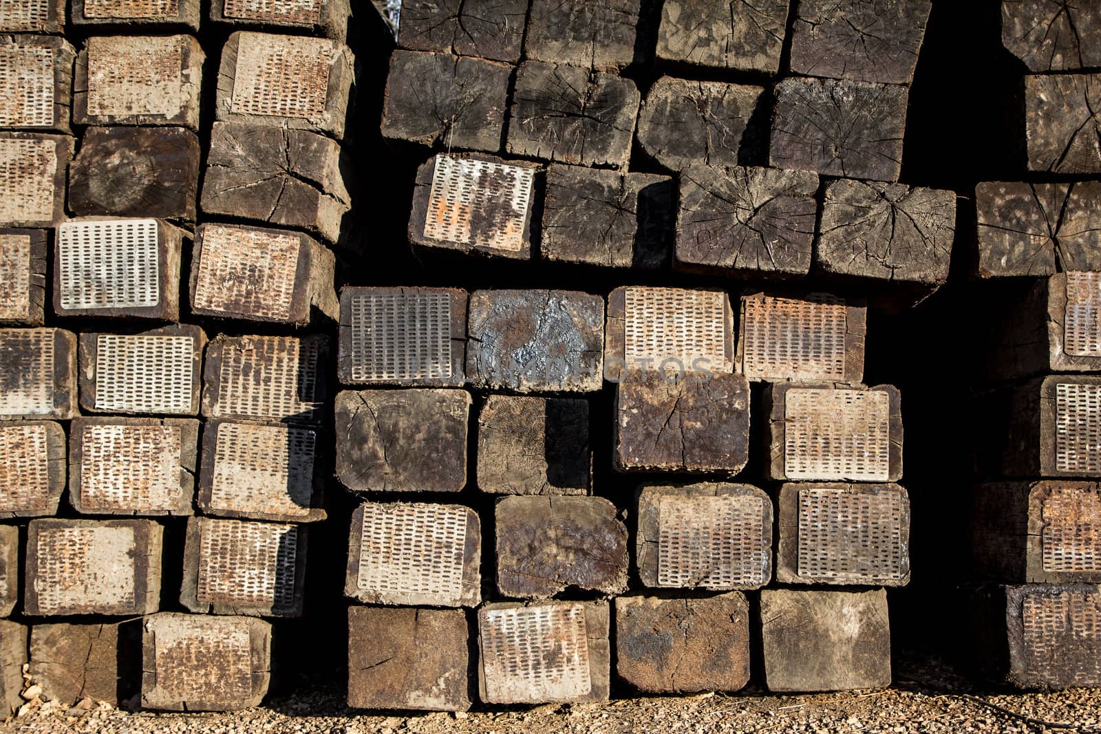 Stacked Railroad Ties Near the Side of the Tracks