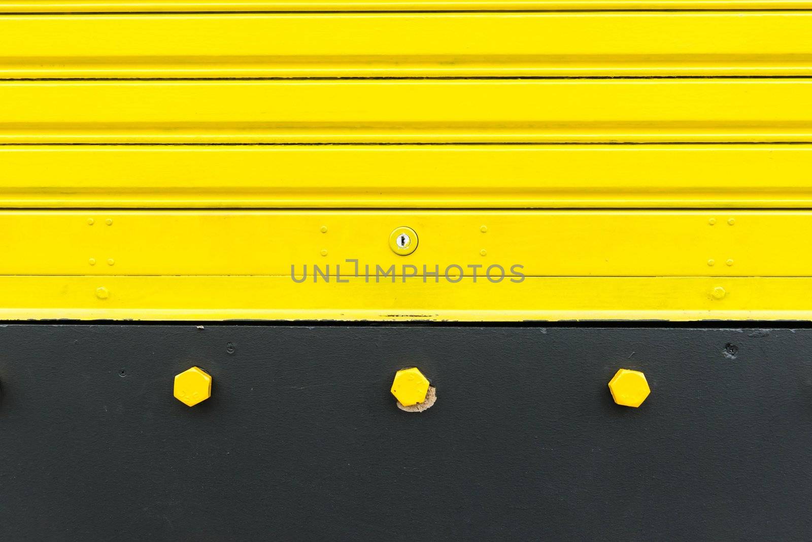 Bright yellow metal sliding door with key hole by sasilsolutions