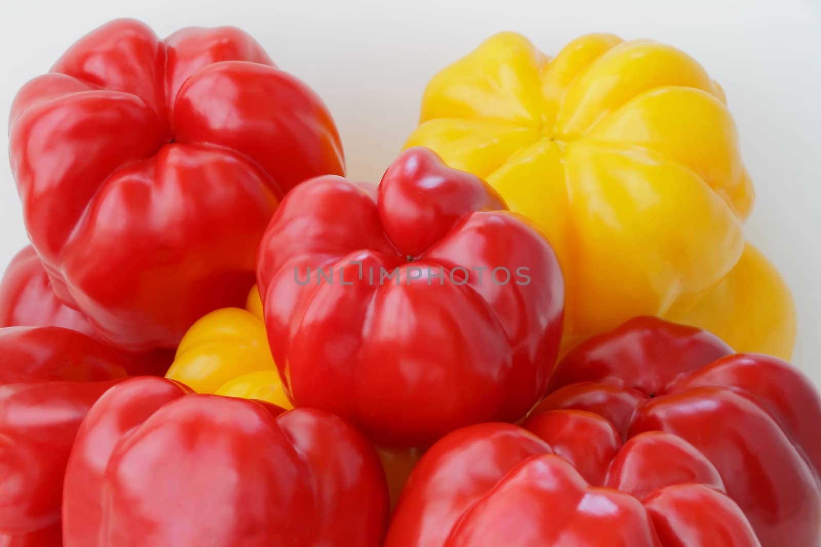 Image of red and yellow raw pepper