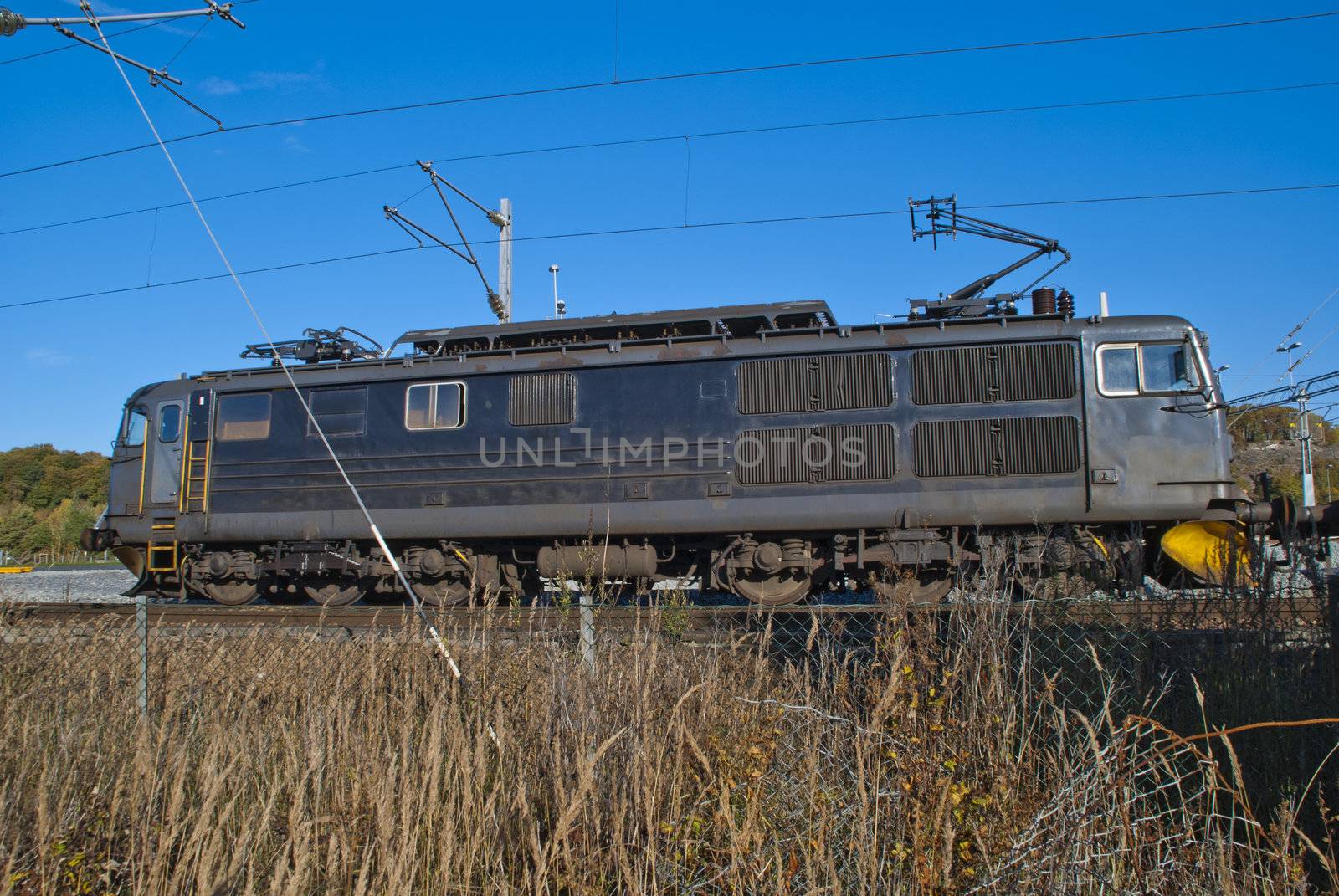 El. 14 is an electric locomotive that is now used by CargoNet to pull freight trains in Norway. El 14 has also gone in person traffic at NSB, but as of today are all locomotives used by CargoNet. Picture is shot just off Halden railway station.