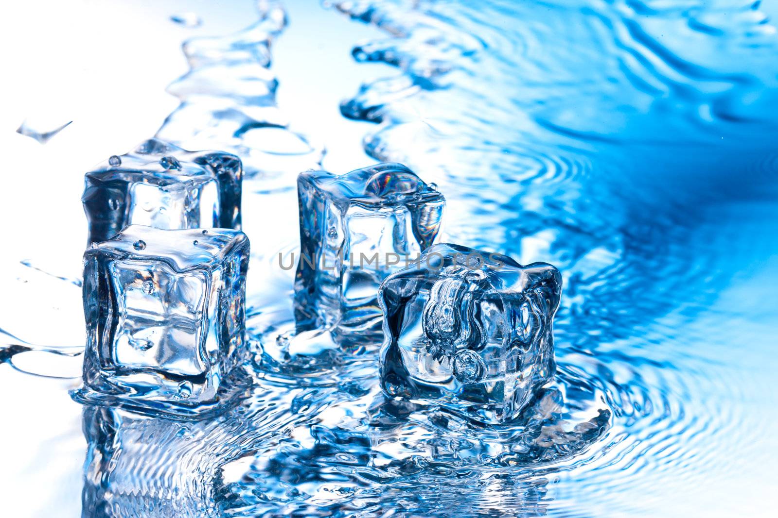 ice cube with pure water on reflective surface