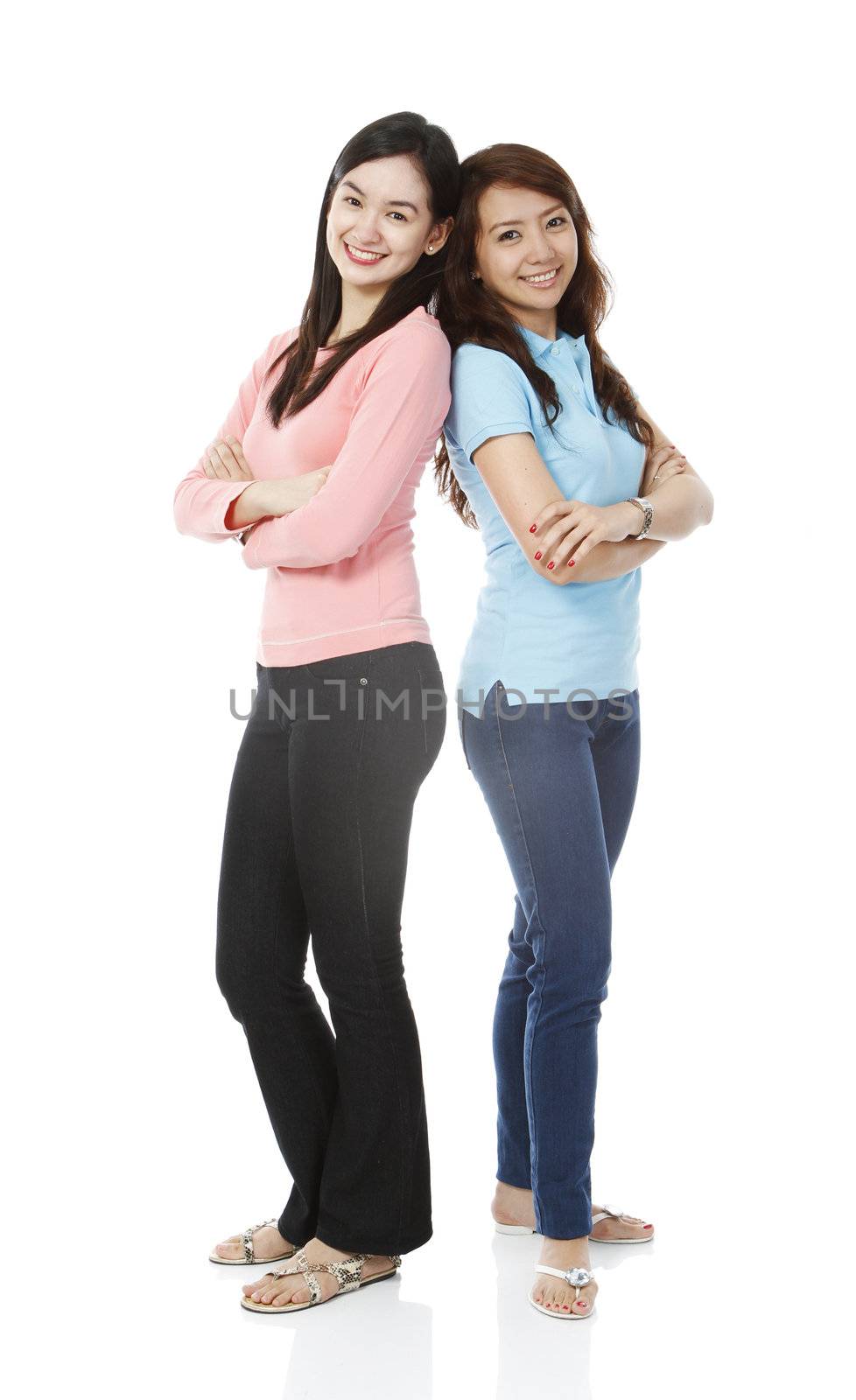 Full body shot of two young women wearing casual clothes