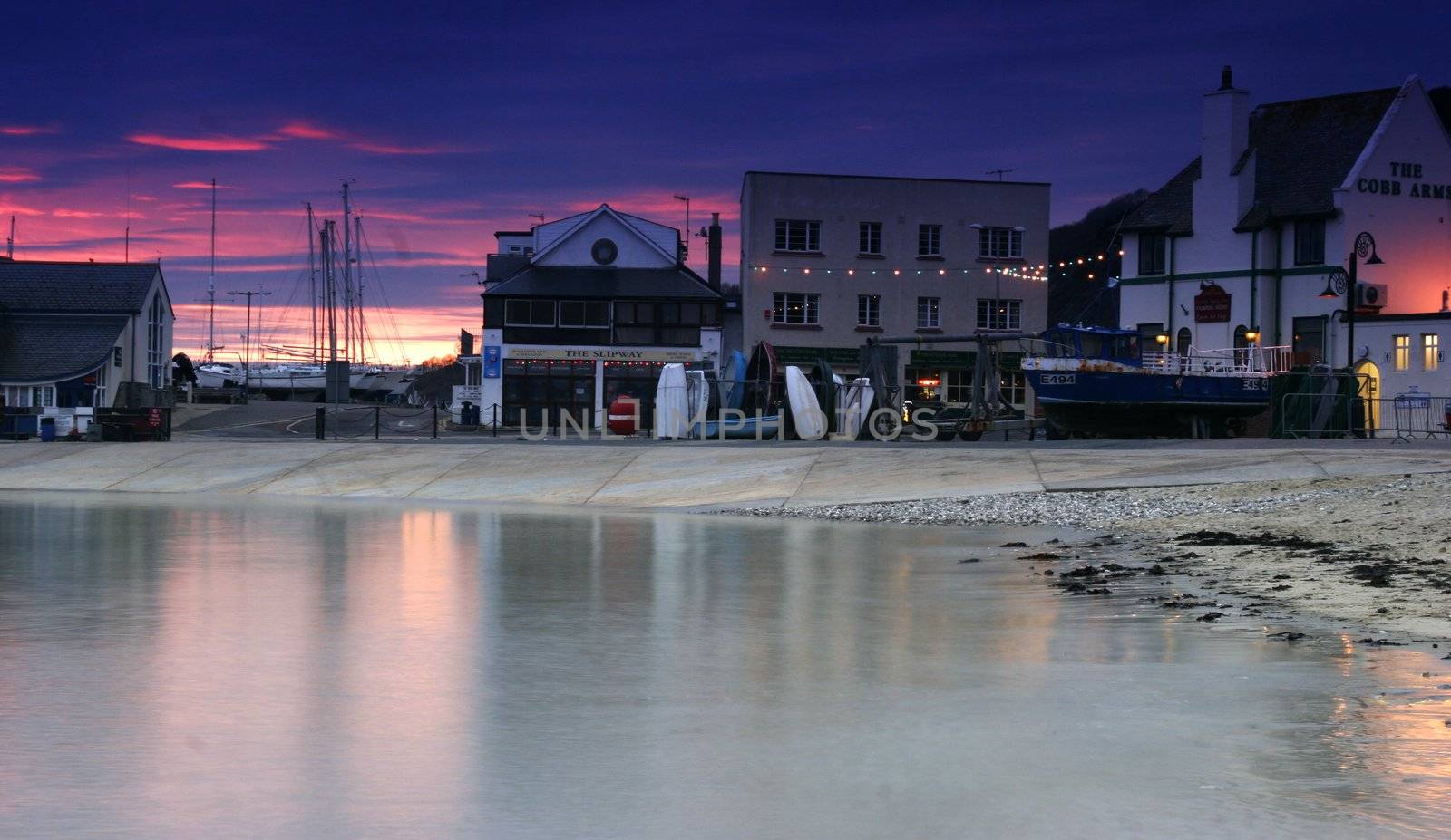 The Cobb in Lyme Regis at sunset by olliemt