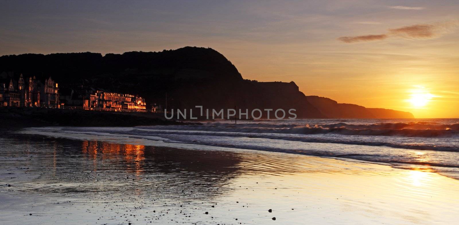 Sidmouth beach at sunset by olliemt