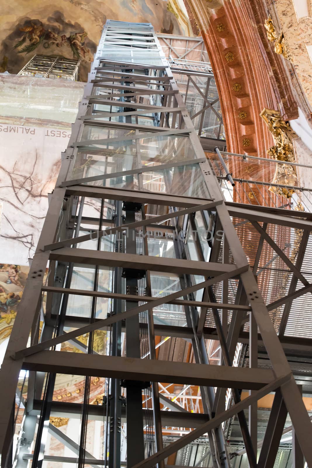 VIENNA - OCTOBER 5: The St. Charles' Church (Karlskirche) in Vienna is undergoing major renovations on October 5,2012 in Vienna, Austria . As a benefit for its visitors, a comfortable elevator plus additional 120 stairs lead to the highest point of the church, bringing the visitor very close to the frescos and architecture of the church.