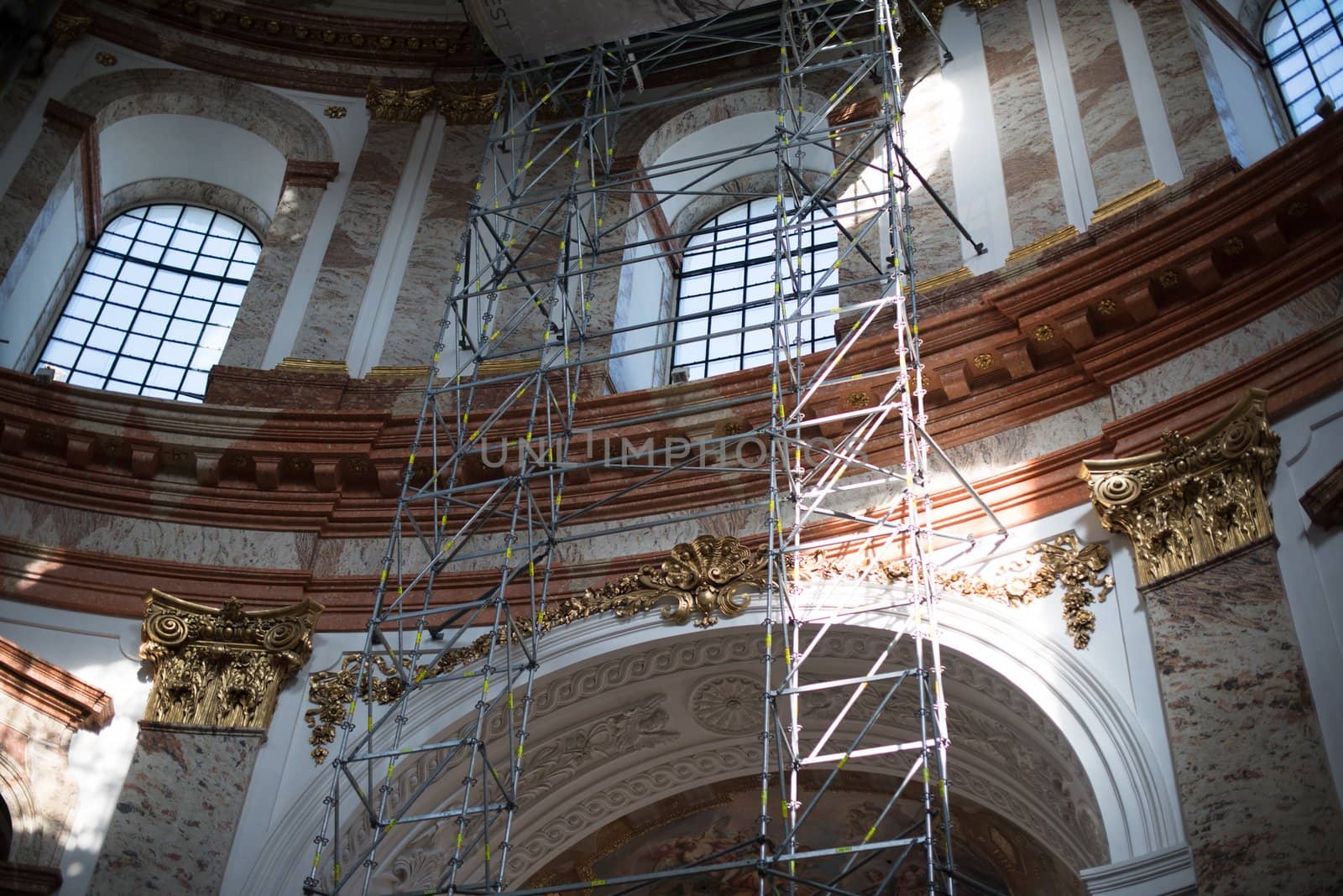 VIENNA - OCTOBER 5: The St. Charles' Church (Karlskirche) in Vienna is undergoing major renovations on October 5,2012 in Vienna, Austria . As a benefit for its visitors, a comfortable elevator plus additional 120 stairs lead to the highest point of the church, bringing the visitor very close to the frescos and architecture of the church.